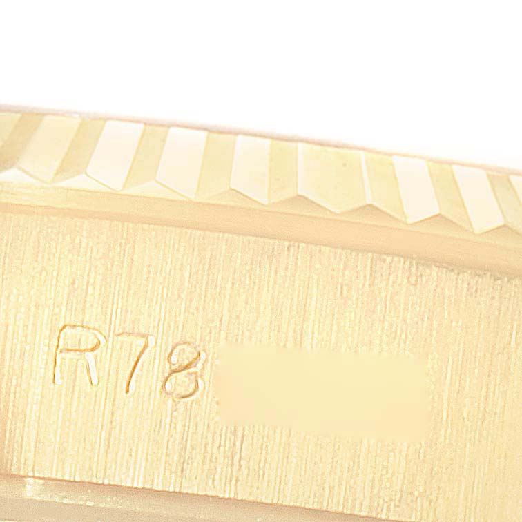 The image shows a close-up of the outer edge and serial number engraving on the side of a Rolex President 69178 Women
s Yellow Gold Champagne Dial 69178 Women
s Yellow Gold Champagne Dial model watch.