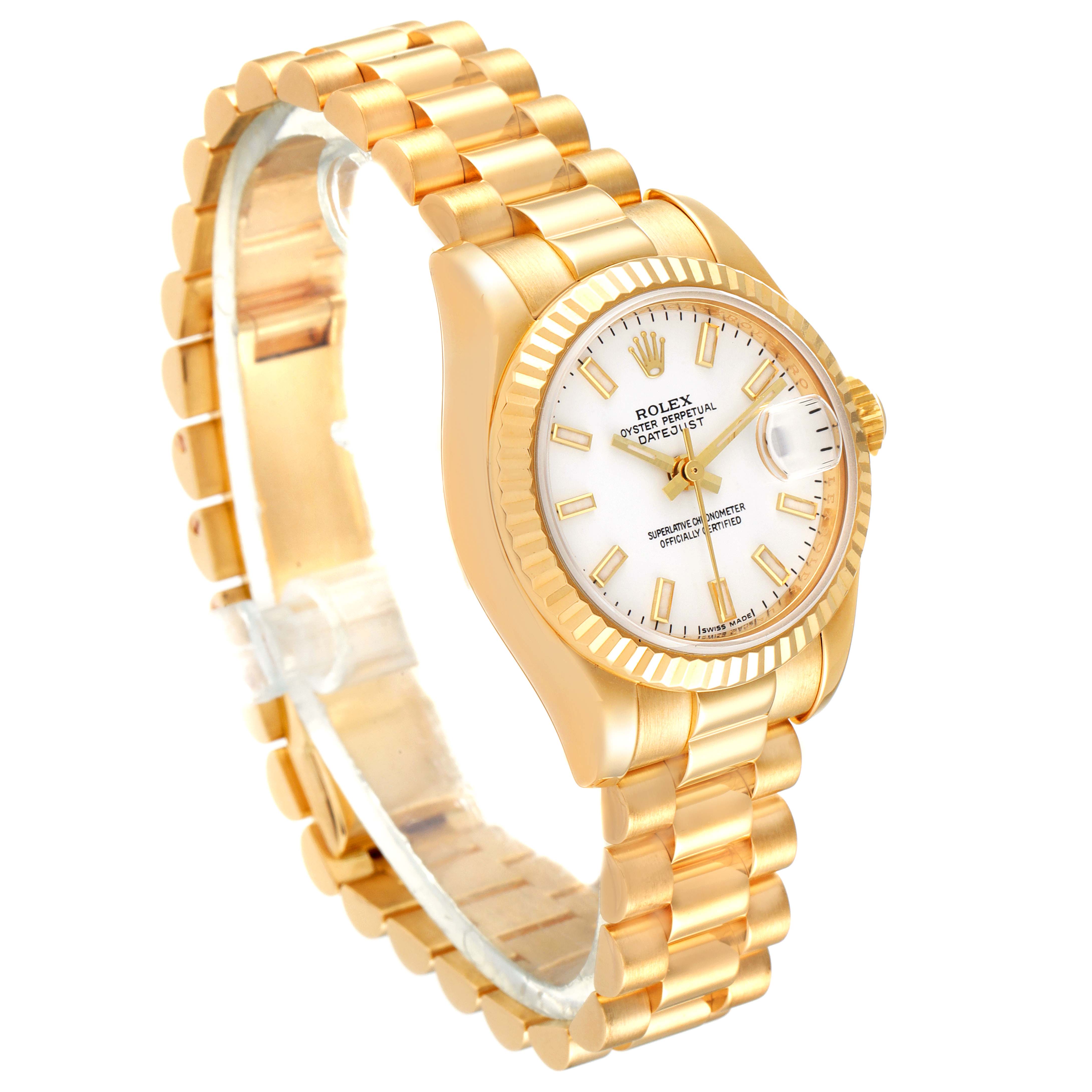 The image shows a Rolex President 179178 Women
s Yellow Gold White Dial 179178 Women
s Yellow Gold White Dial model watch with a gold bracelet, dial, and fluted bezel, viewed at a side-front angle.