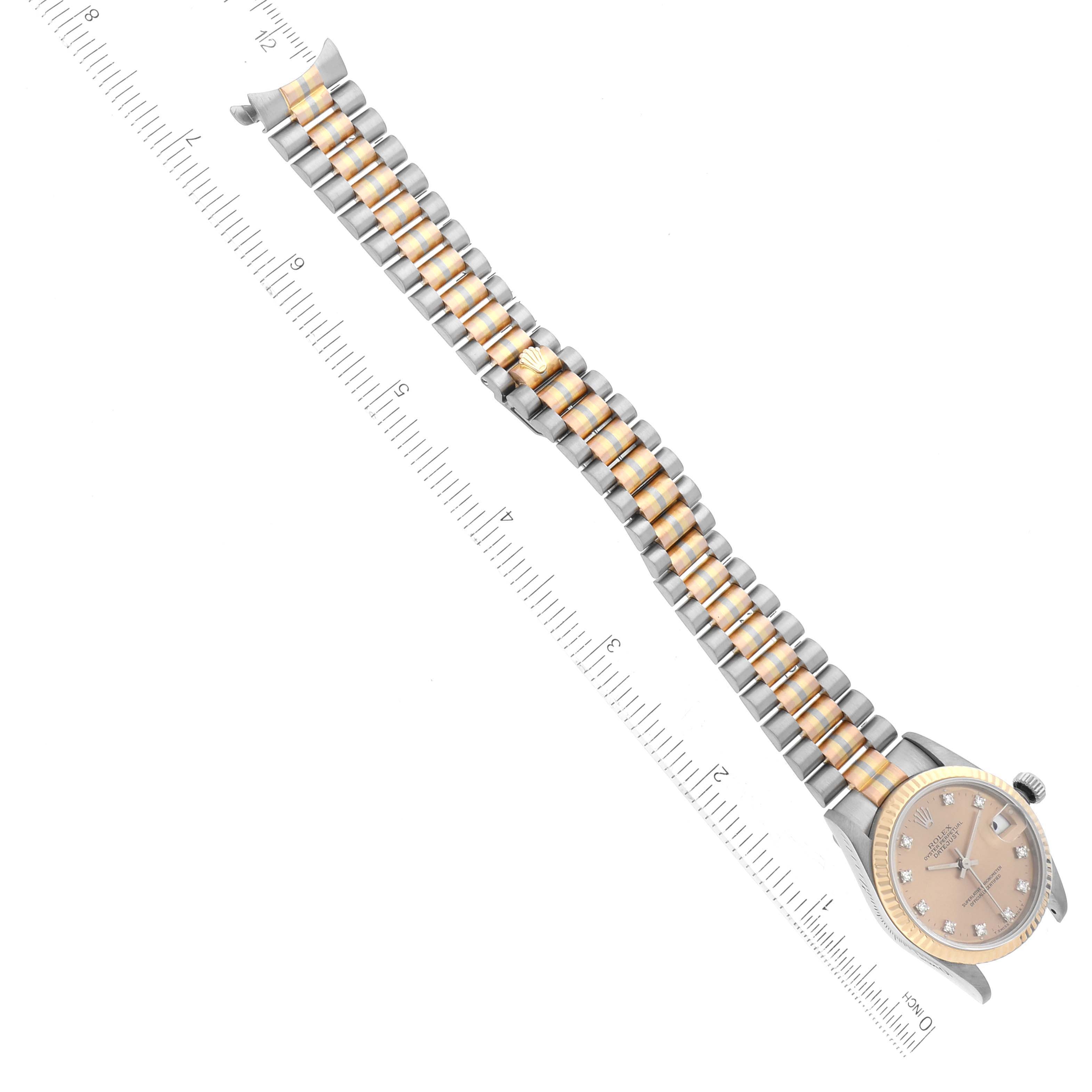 The image shows a Rolex President 68279 Women's White Gold Champagne Dial 68279 Women's White Gold Champagne Dial model watch partially from the top, including its dial, case, and two-tone bracelet beside a ruler.