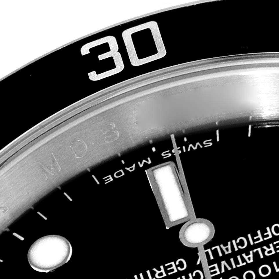 This close-up image showcases the bezel, dial, and part of the minute hand of the Rolex Submariner 16610 Men
s Stainless Steel Black Dial 16610 Men
s Stainless Steel Black Dial watch.