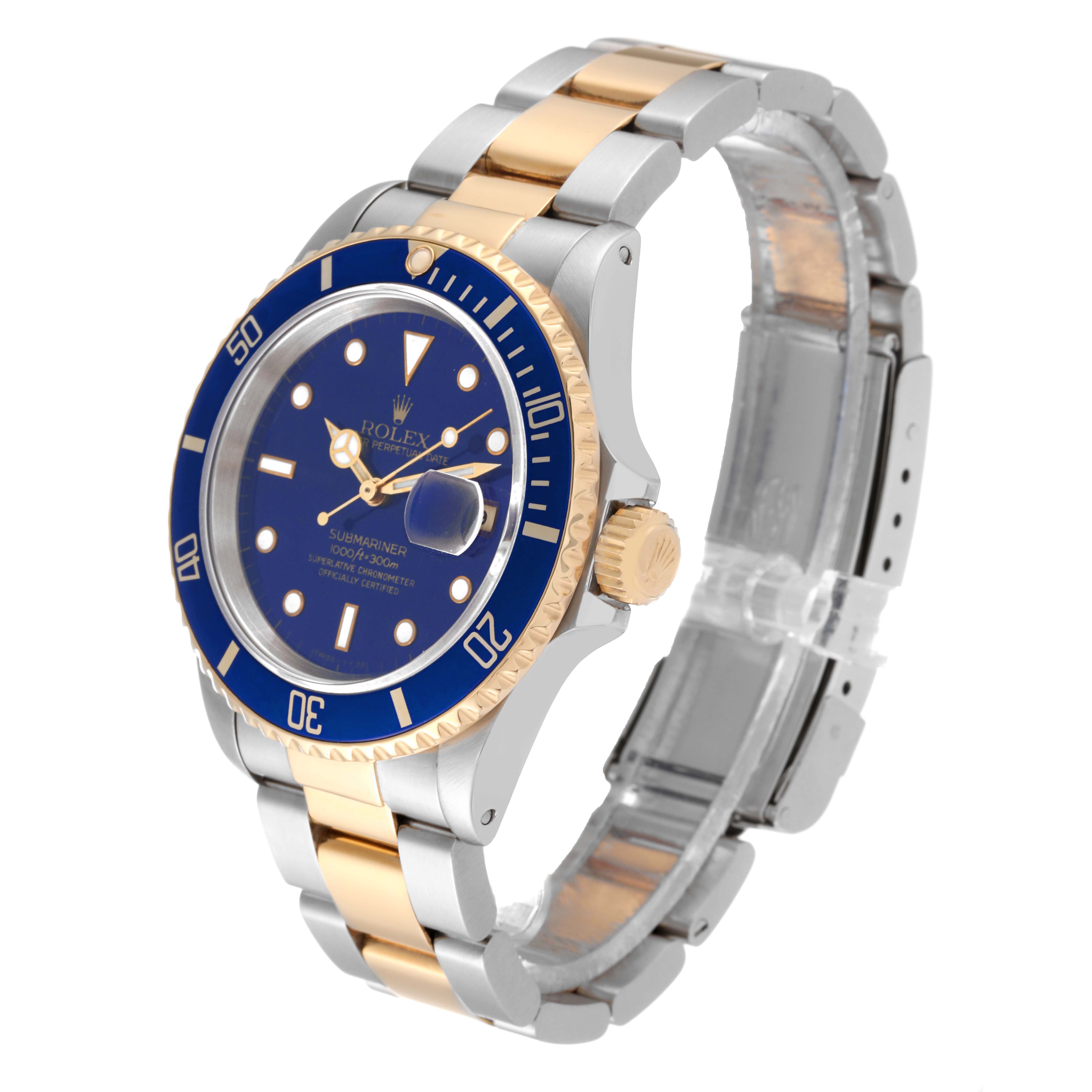 The Rolex Submariner 16613 Men
s Steel and Gold (two tone) Blue Dial 16613 Men
s Steel and Gold (two tone) Blue Dial watch is shown at an angle, highlighting the bezel, dial, crown, and two-tone bracelet.
