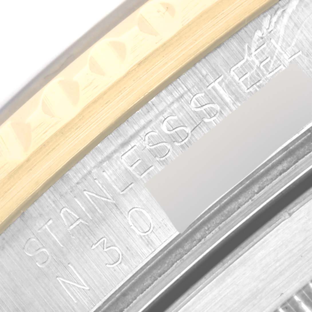 This close-up angle shows the "stainless steel" engraving on the bezel of a Rolex Submariner 16613 Men
s Steel and Gold (two tone) Blue Dial 16613 Men
s Steel and Gold (two tone) Blue Dial watch.