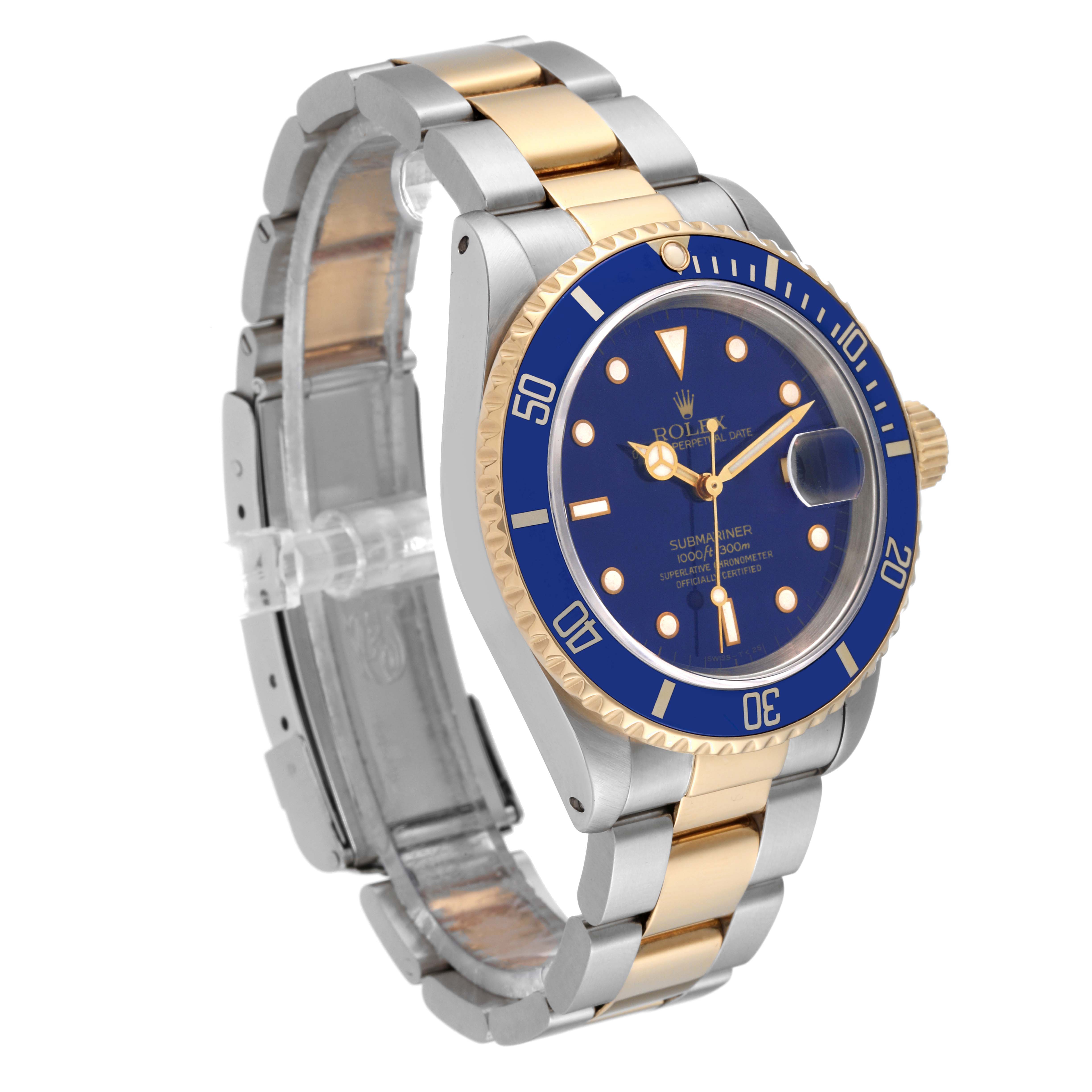 The image shows a Rolex Submariner 16613 Men
s Steel and Gold (two tone) Blue Dial 16613 Men
s Steel and Gold (two tone) Blue Dial watch at an angled front view, highlighting its blue bezel and dial with a silver and gold metal bracelet.
