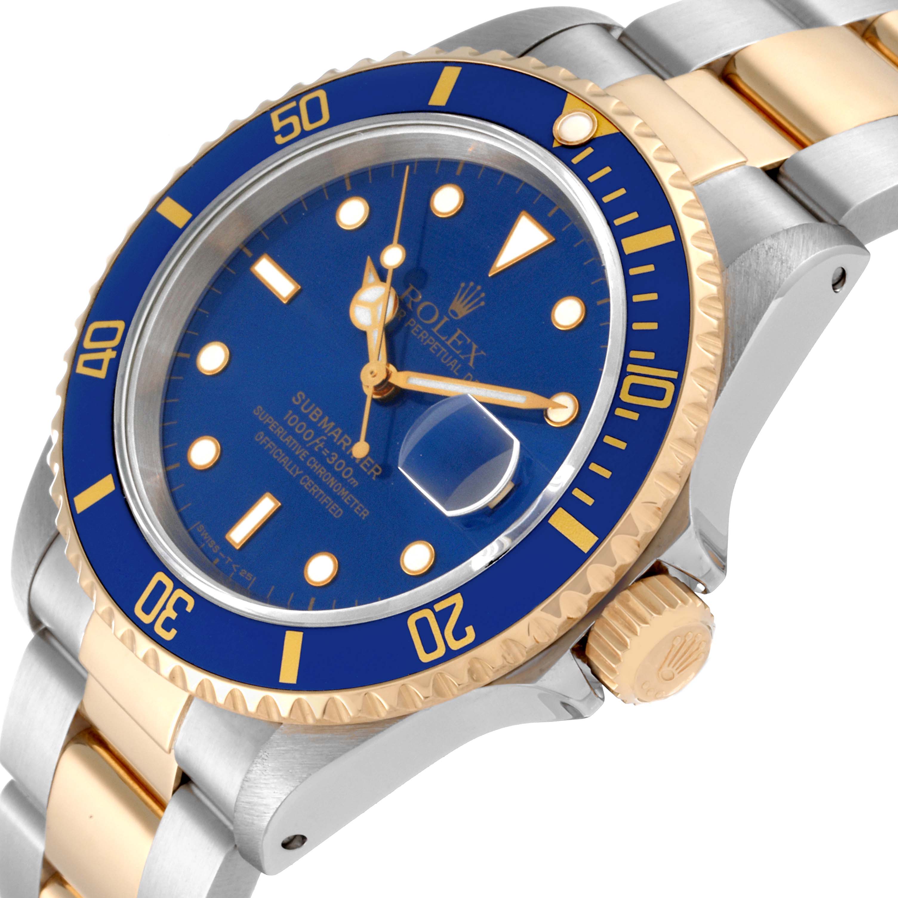 The image shows a close-up angled view of the Rolex Submariner 16613 Men
s Steel and Gold (two tone) Blue Dial 16613 Men
s Steel and Gold (two tone) Blue Dial watch, showcasing its blue dial, bezel, and two-tone bracelet.