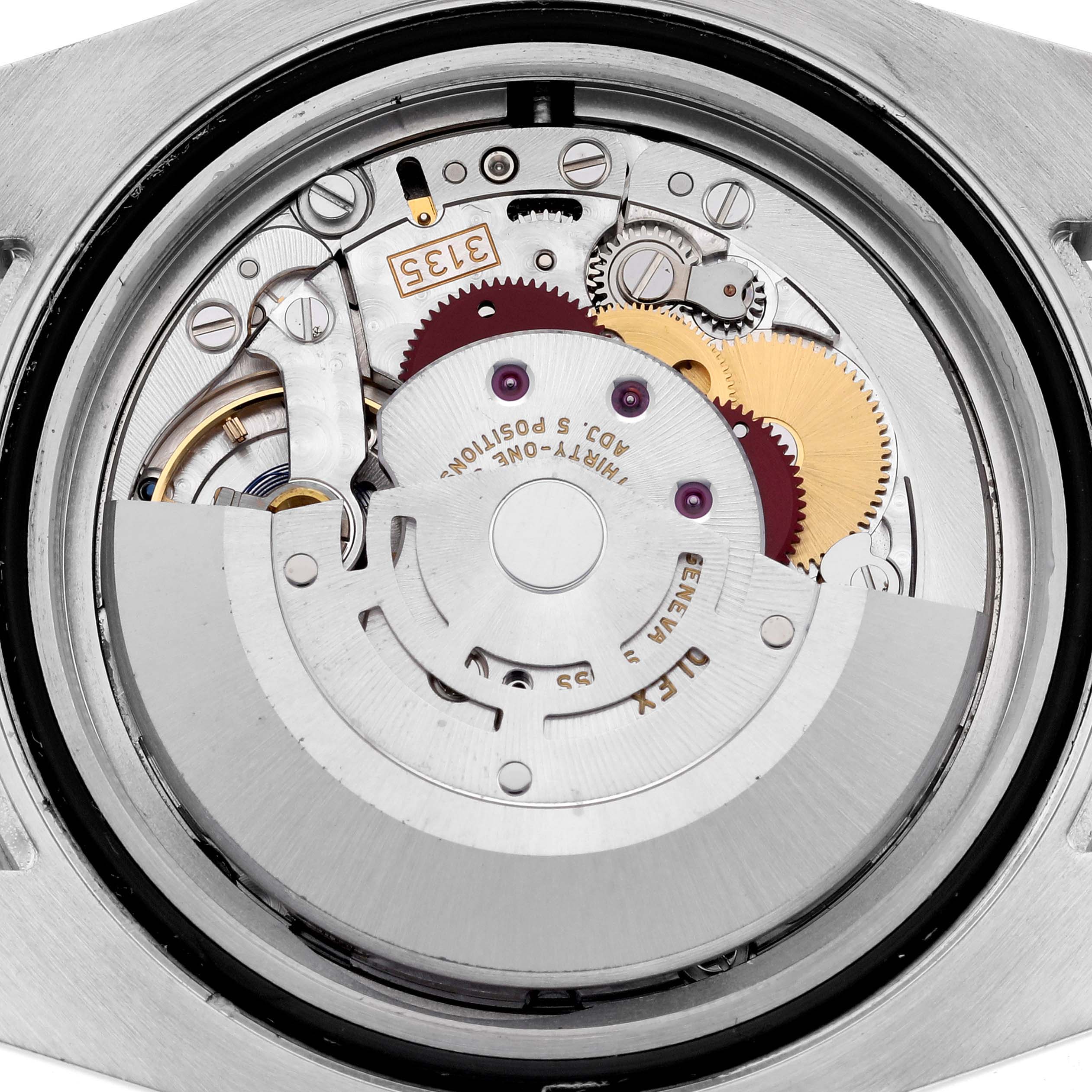 The image shows the internal mechanism of a Rolex Submariner 116610LN Men's Stainless Steel Black Dial 116610LN Men's Stainless Steel Black Dial watch from a close-up, showcasing gears and movement components.