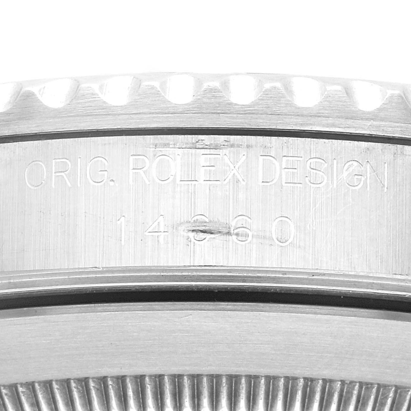 This close-up shows the case side with the engraved model "14060" and "ORIG. ROLEX DESIGN" of the Rolex Submariner 14060 Men
s Stainless Steel Black Dial 14060 Men
s Stainless Steel Black Dial watch.