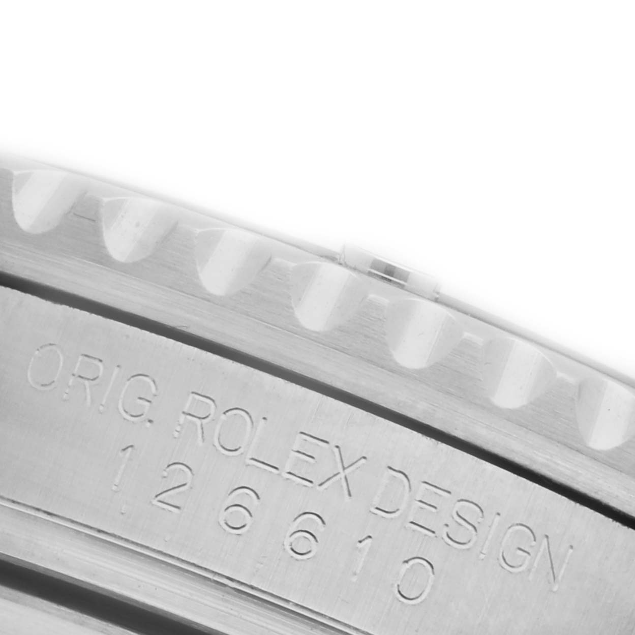 The image shows a close-up of the edge and engraving on the bezel of a Rolex Submariner 126610LV Men's Stainless Steel Black Dial 126610LV Men's Stainless Steel Black Dial watch.