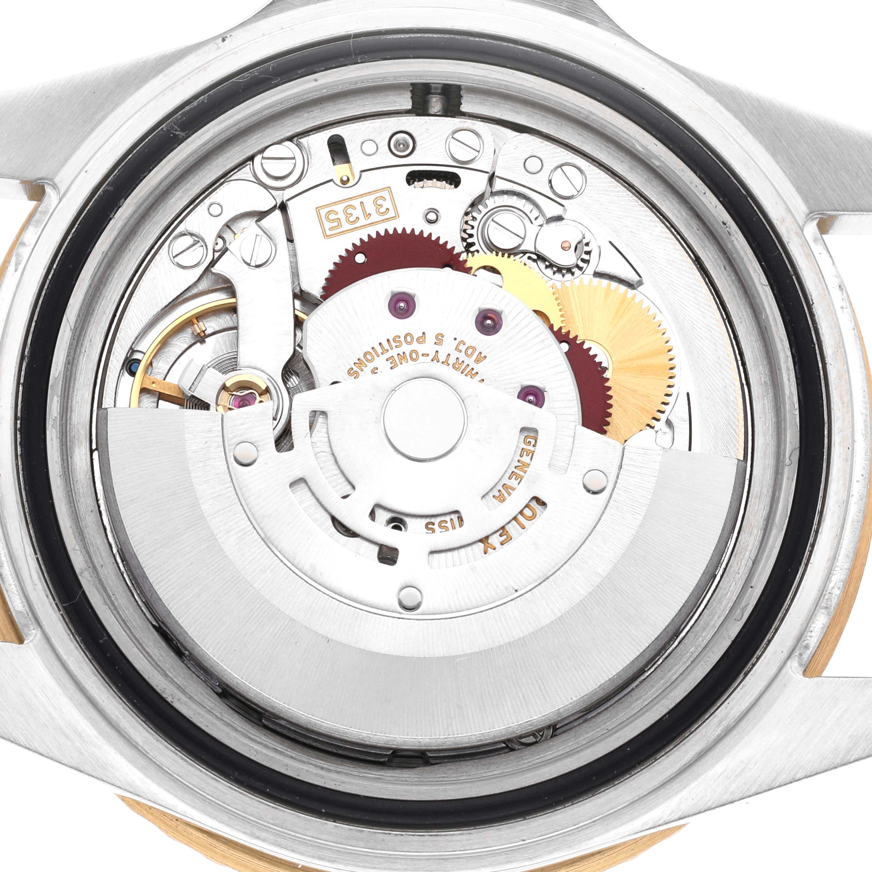 This image shows the interior mechanical movement of the Rolex Submariner 16613 Men
s Steel and Gold (two tone) Grey Dial 16613 Men
s Steel and Gold (two tone) Grey Dial watch from a back angle with its internal components exposed.