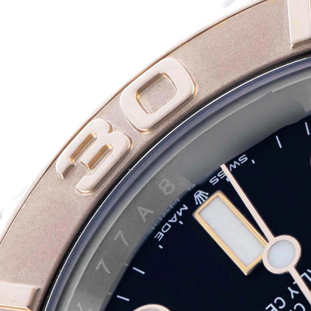 The image shows a close-up of the Rolex Yacht-Master 126621 Men's Steel and Gold (two tone) Black Dial's bezel and part of the dial, highlighting the "30" marking.