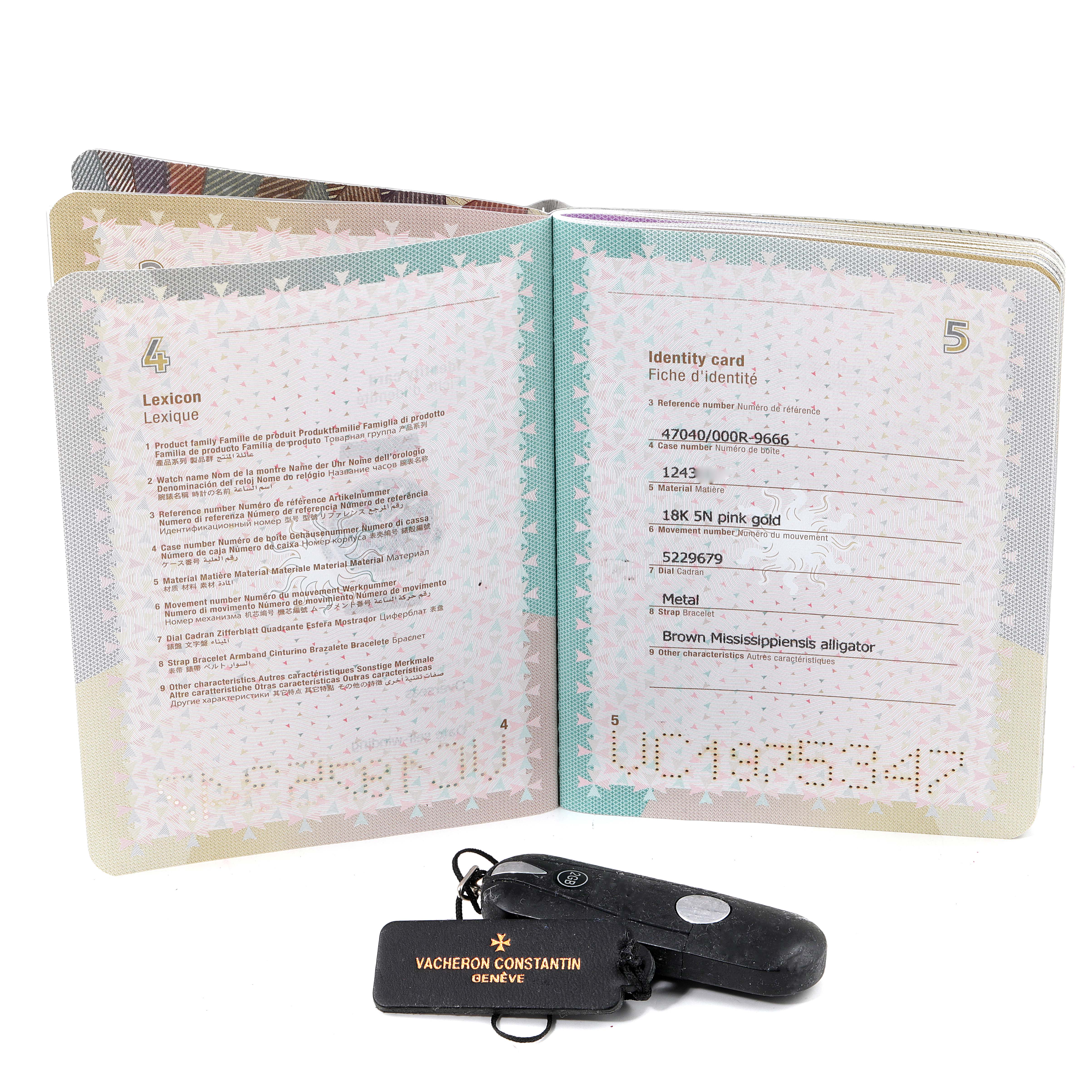 The image shows the paperwork, including the identity card, and a keychain for the Vacheron Constantin Overseas 47040/000R-9666 Men's Rose Gold Black Dial 47040/000R-9666 Men's Rose Gold Black Dial model watch.