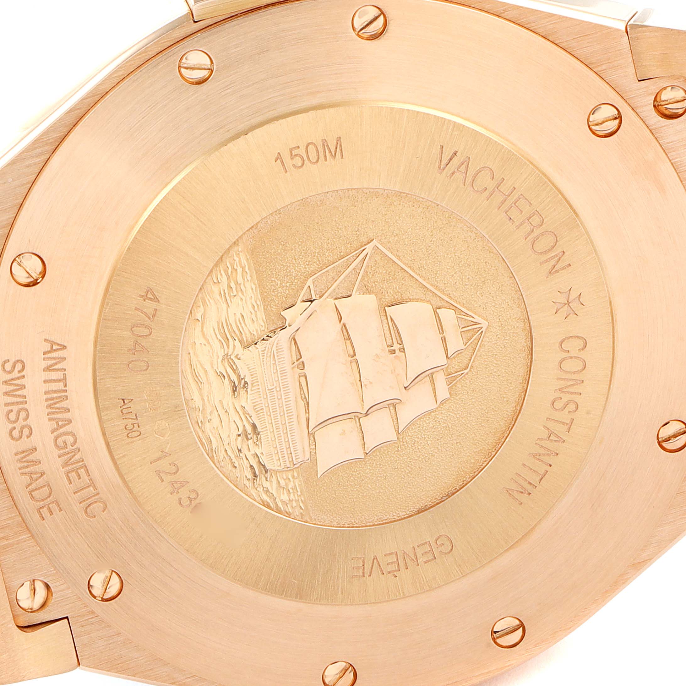 The image shows the case back of the Vacheron Constantin Overseas 47040/000R-9666 Men's Rose Gold Black Dial 47040/000R-9666 Men's Rose Gold Black Dial watch, highlighting the engraved sailboat and inscriptions.
