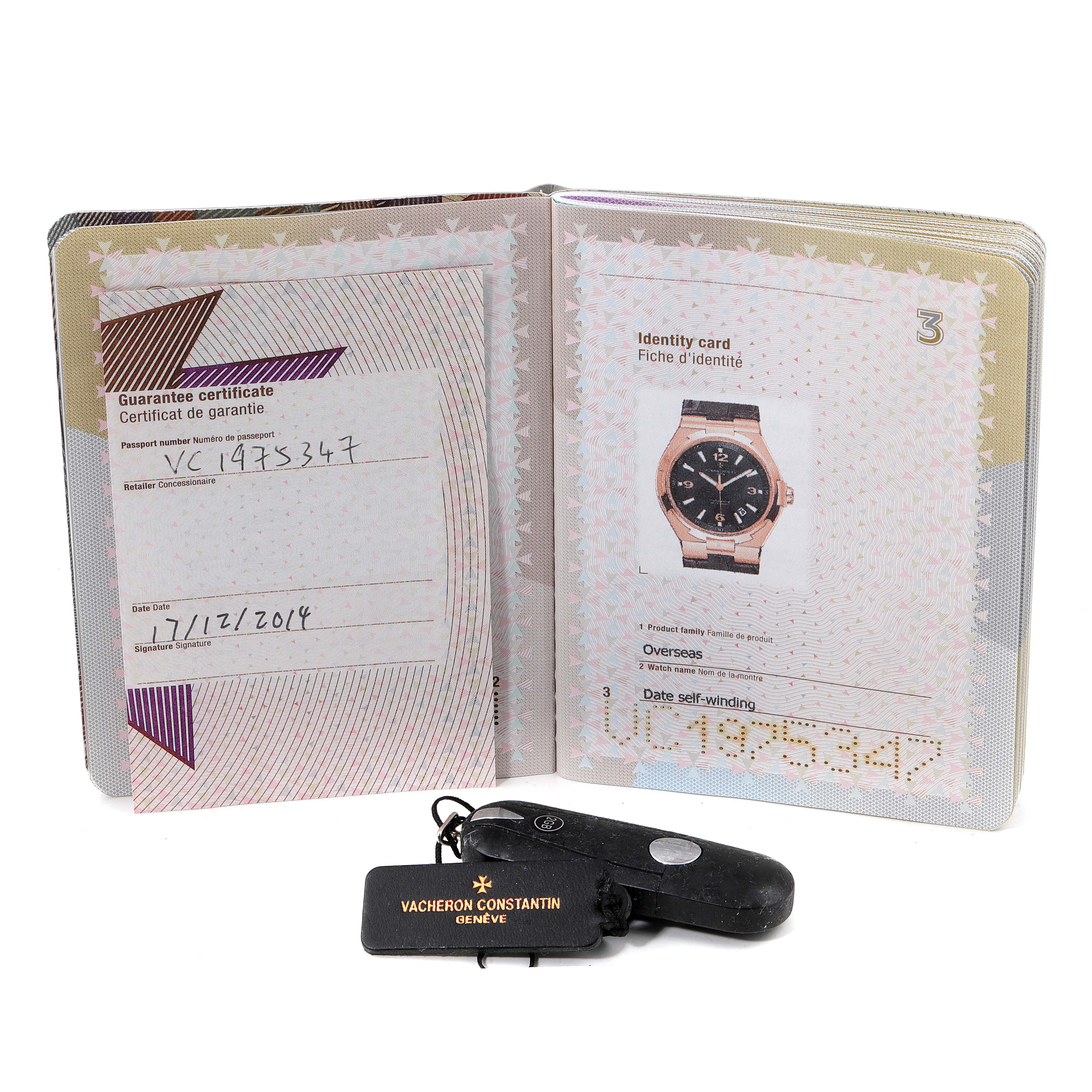 The image shows the guarantee certificate, identity card, and keychain for the Vacheron Constantin Overseas 47040/000R-9666 Men's Rose Gold Black Dial 47040/000R-9666 Men's Rose Gold Black Dial model watch.