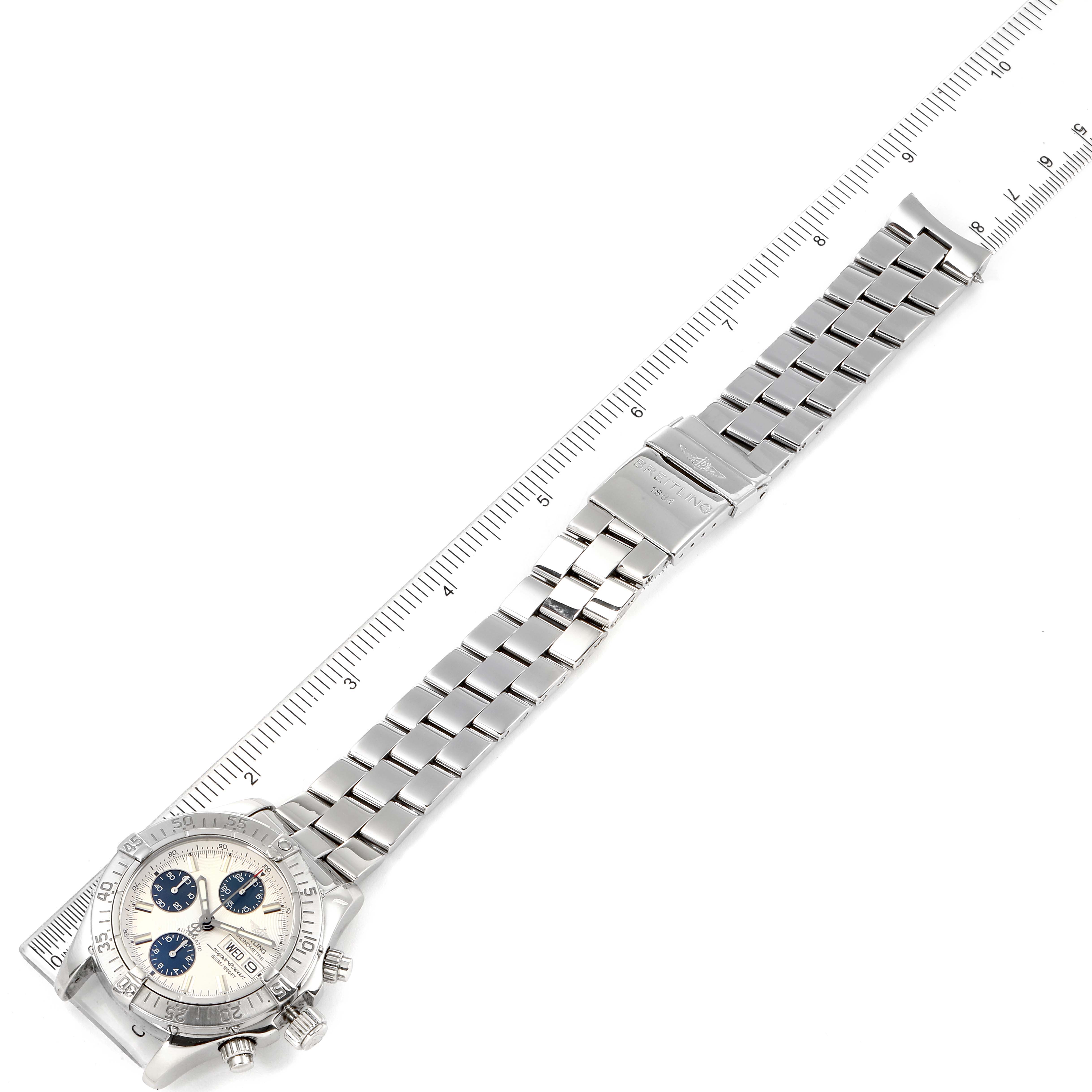 The image shows the Breitling Superocean A13340 Men's Stainless Steel Beige Dial A13340 Men's Stainless Steel Beige Dial model watch positioned lengthwise, with the full metal bracelet extended and a ruler for scale.