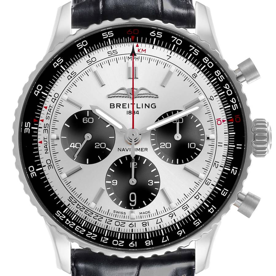 The Breitling Navitimer watch is shown from a front angle, highlighting the dial, bezel, and crown.