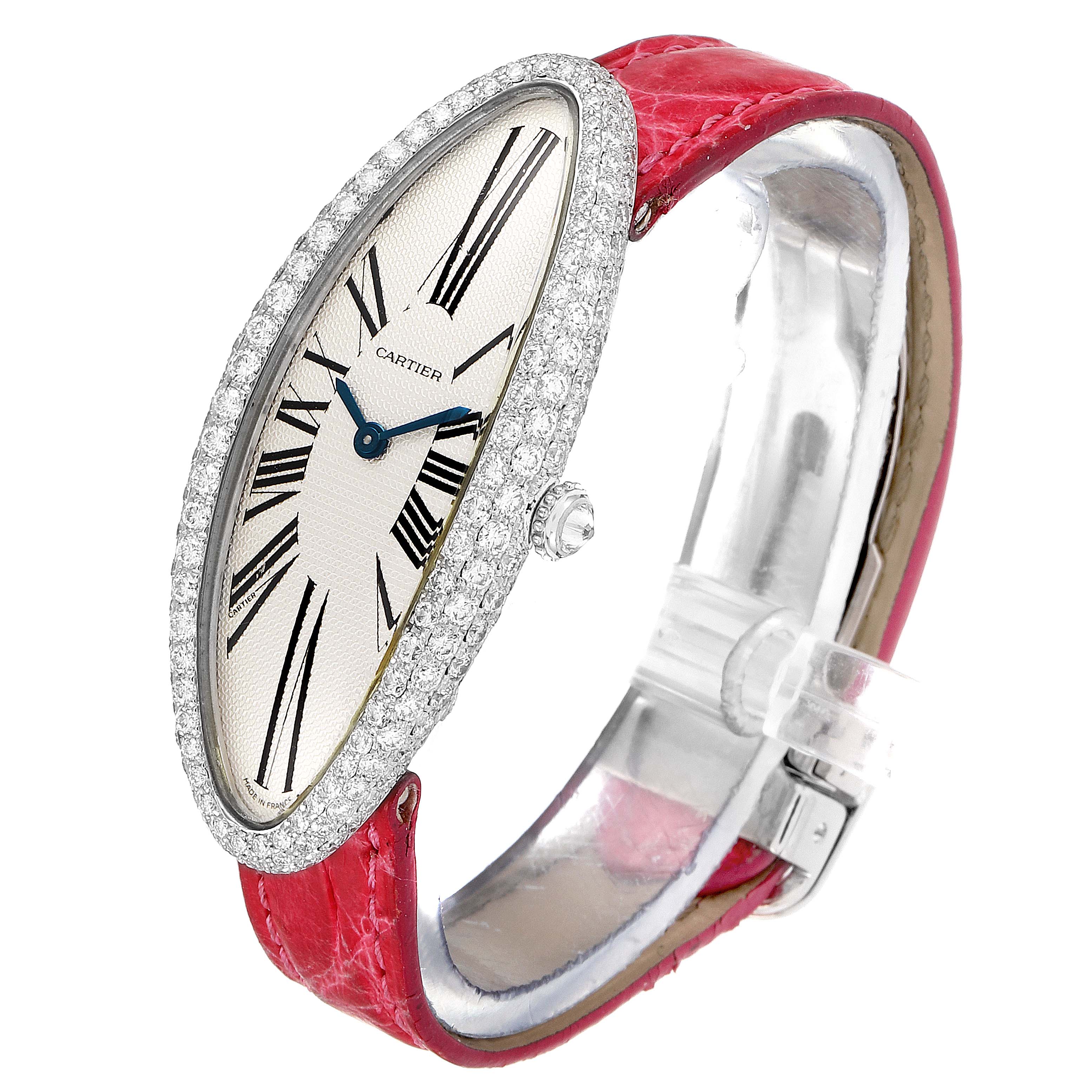 The image shows a Cartier Baignoire WB510931 Women's White Gold Silver Dial WB510931 Women's White Gold Silver Dial watch at a slight angle, highlighting its oval face with diamond bezel and red leather strap.