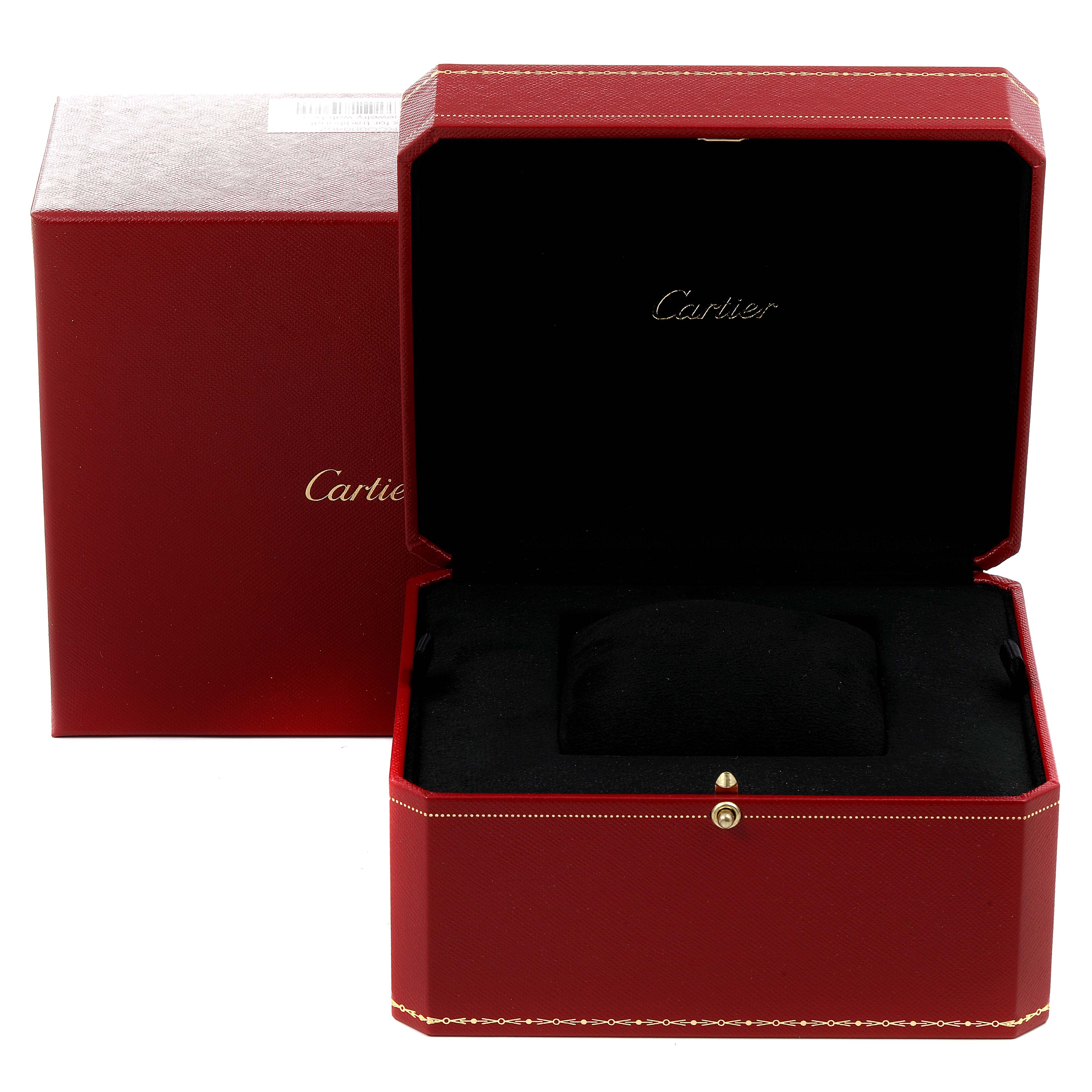 The image shows an open Baignoire watch box by Cartier, with the lid open revealing a black interior pillow.