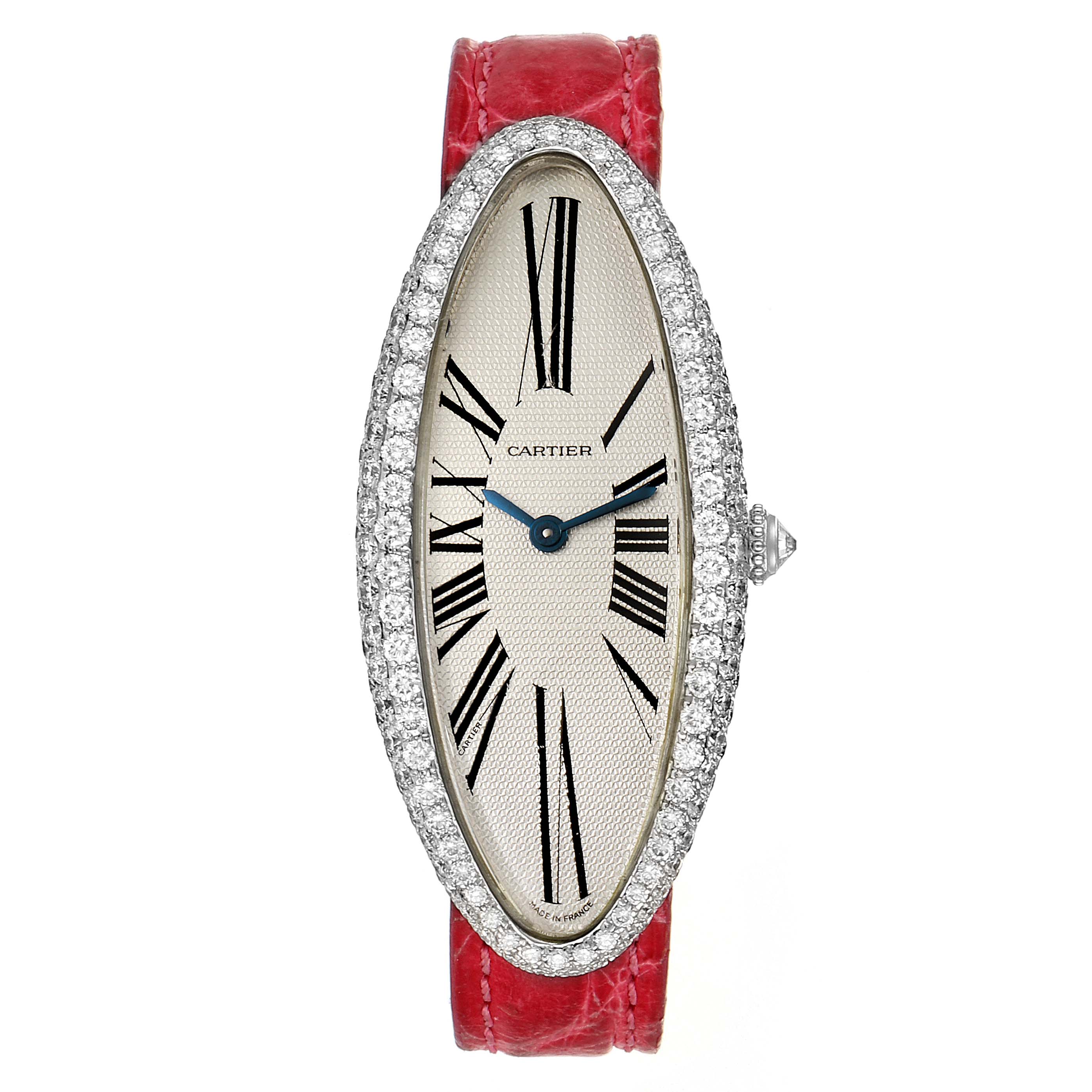 The image shows a Cartier Baignoire WB510931 Women's White Gold Silver Dial WB510931 Women's White Gold Silver Dial model watch from a front angle, featuring a red leather strap and a diamond-encrusted oval bezel.