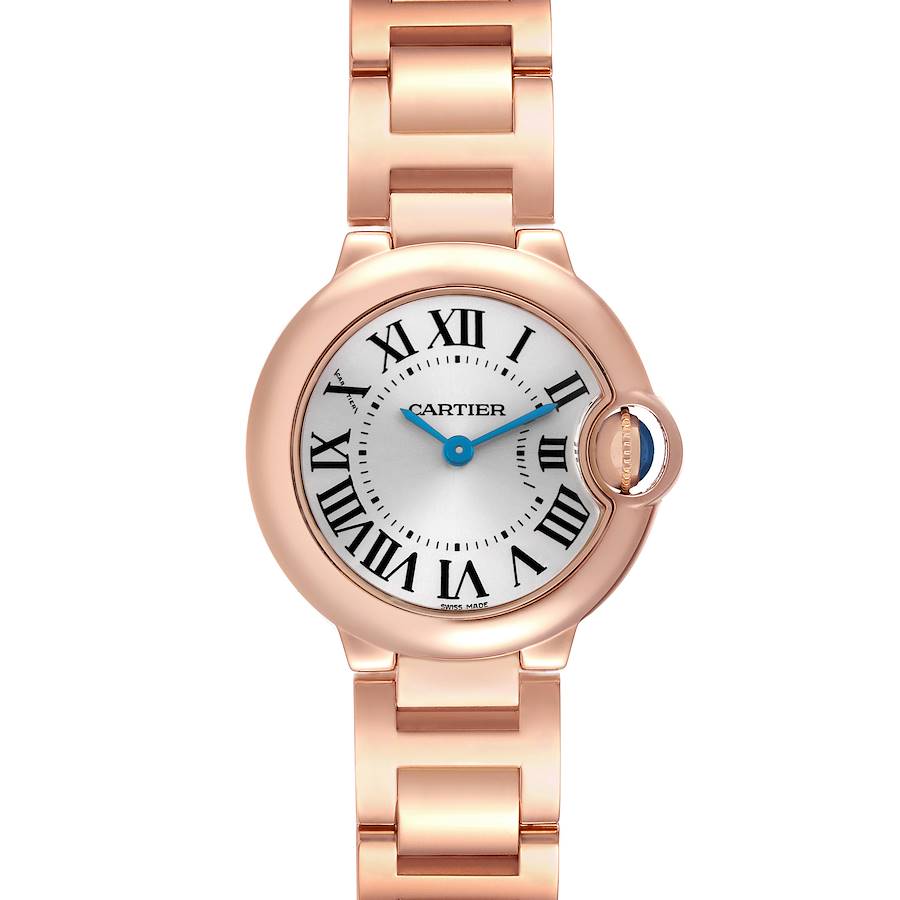 The Cartier Ballon Bleu watch is shown from a top-down angle, displaying its face, roman numerals, and part of the bracelet.