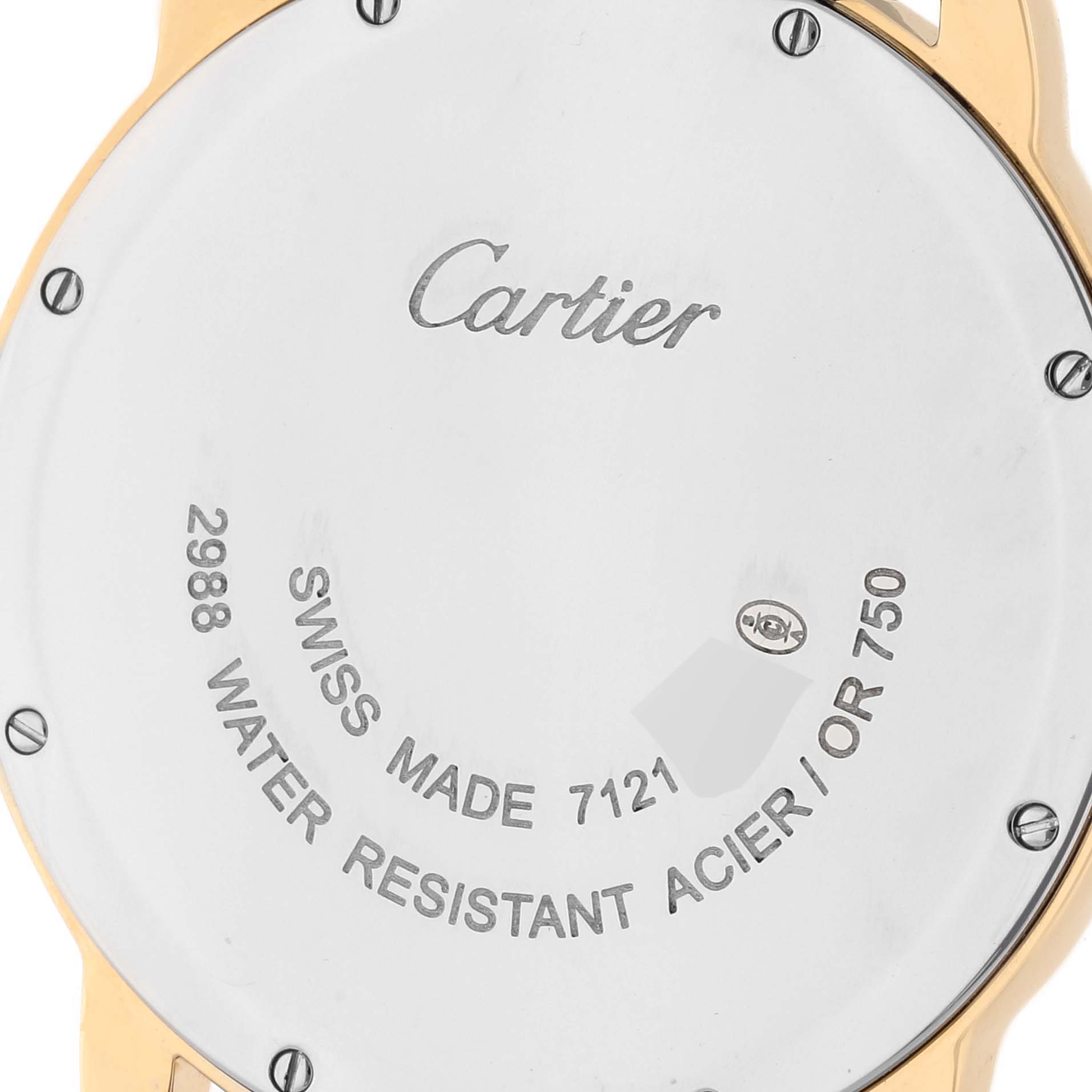 This image shows the back case of the Ronde watch by Cartier, highlighting its inscriptions and screws.