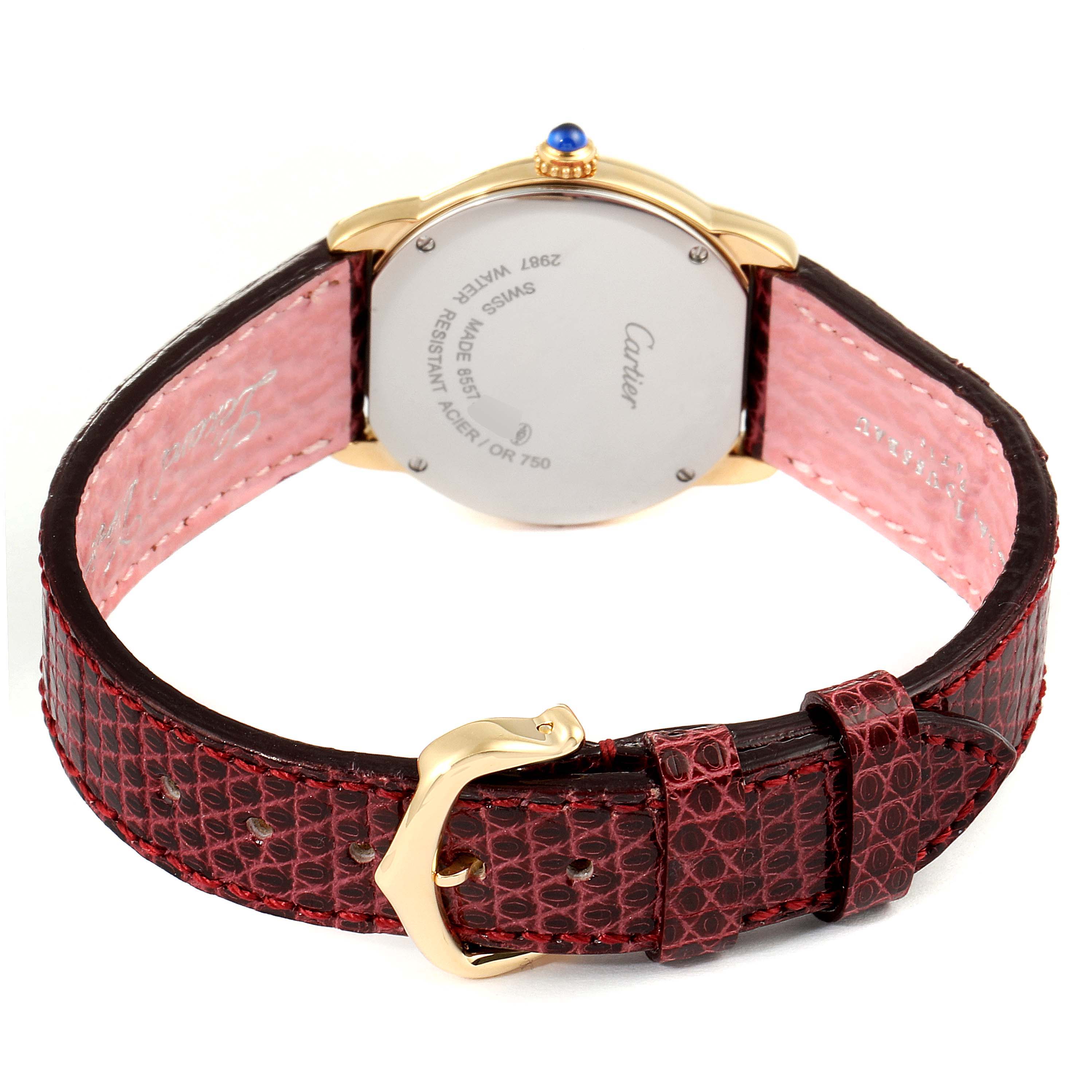 The image shows the back and strap of the Ronde model by Cartier, highlighting the red strap, gold buckle, and case back.