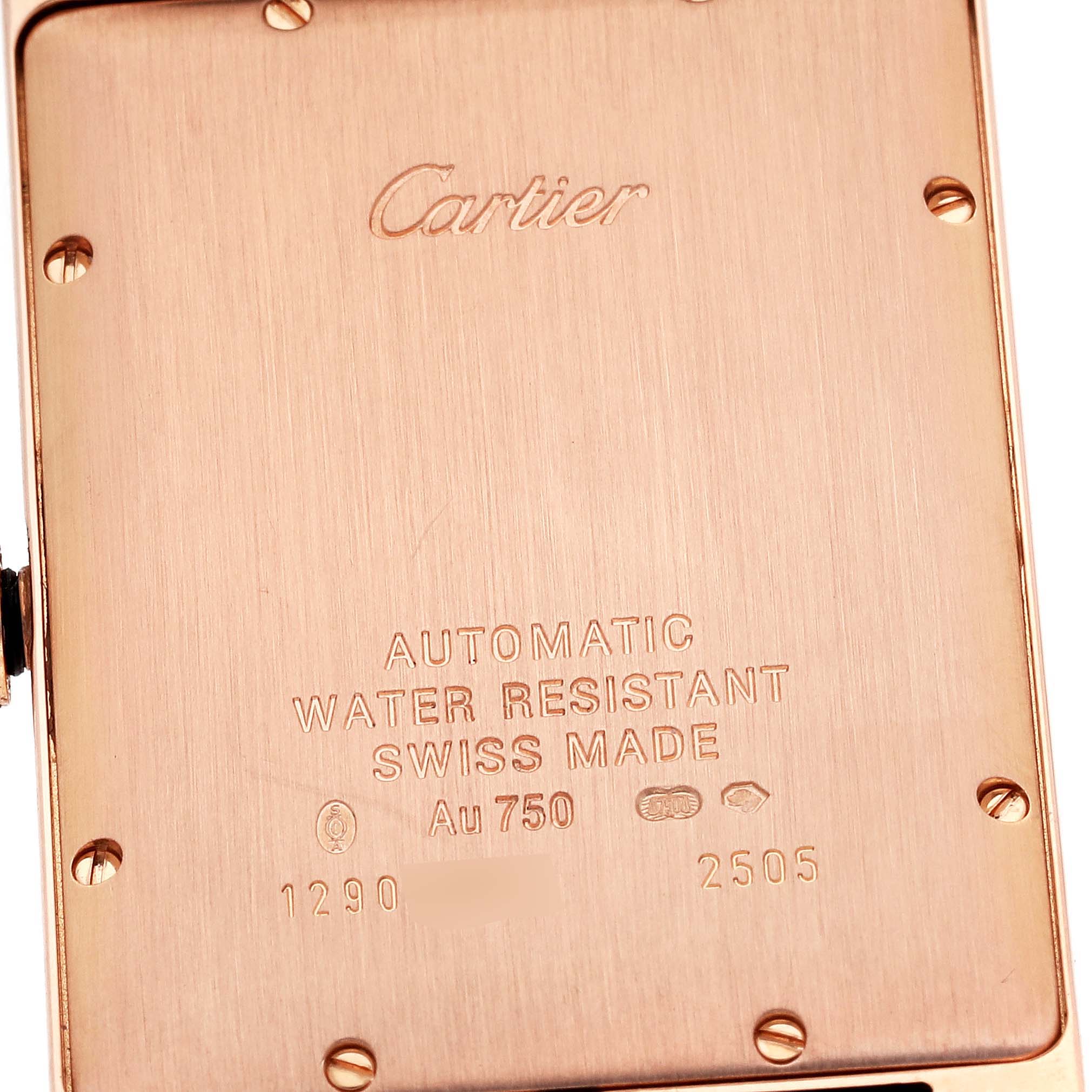 The image shows the back case of a Cartier Tank Américaine watch, highlighting the engravings and screws.