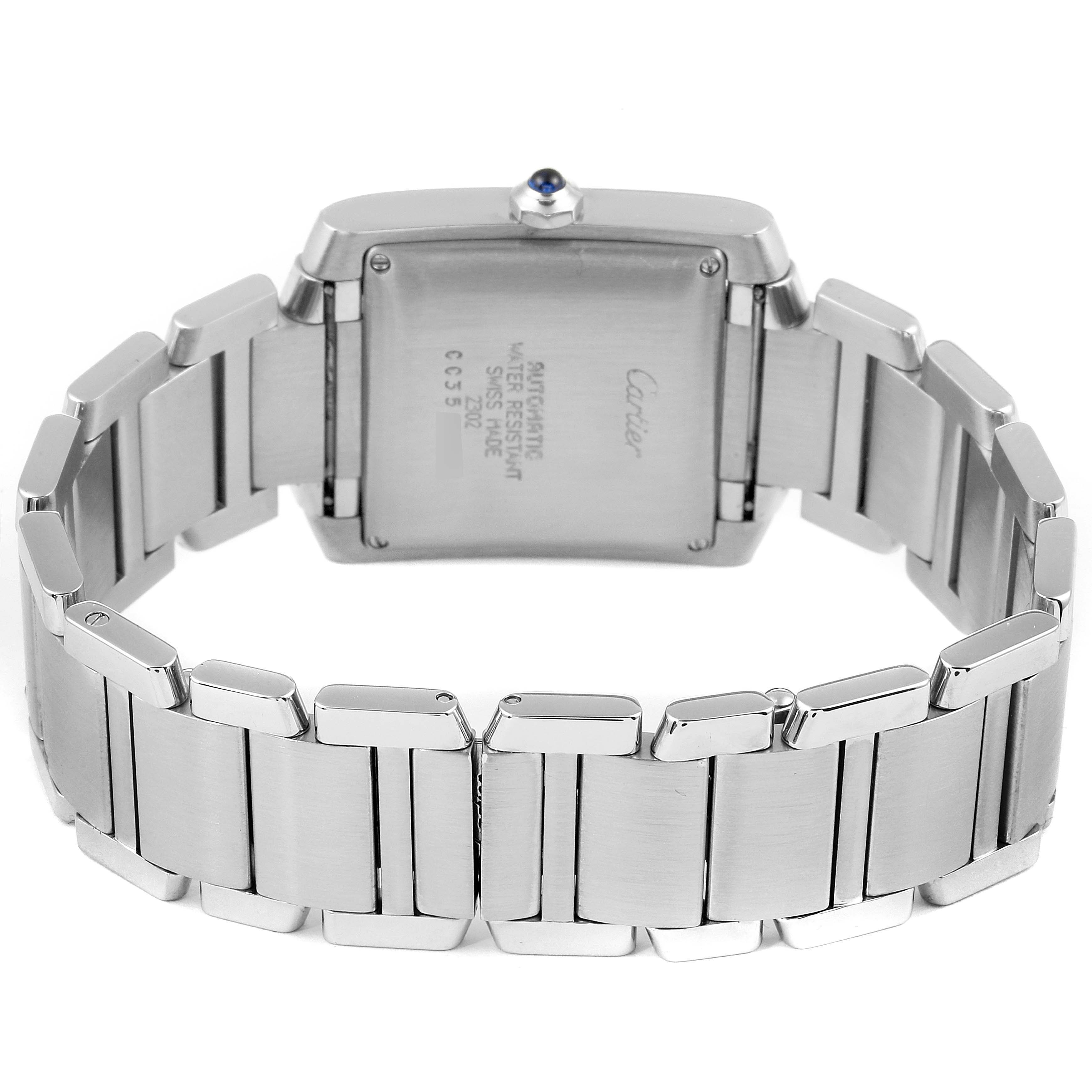 The image shows the back view of a Cartier Tank Francaise W51002Q3 Men's Stainless Steel Silver Dial W51002Q3 Men's Stainless Steel Silver Dial watch, highlighting its metal bracelet and case back.