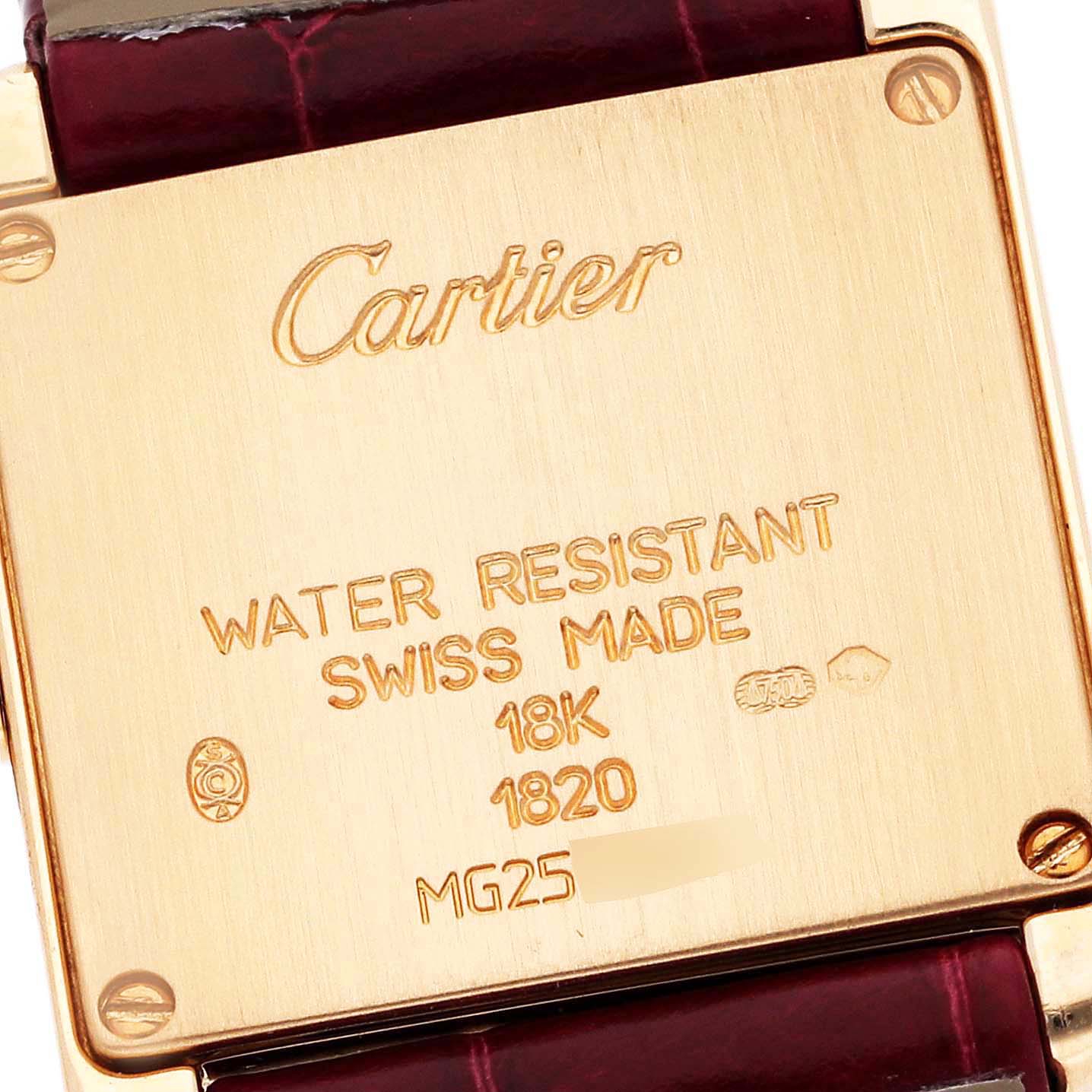 The image shows the back casing of a Cartier Tank Francaise W5000256 Women's Yellow Gold Silver Dial W5000256 Women's Yellow Gold Silver Dial watch, highlighting its inscriptions and part of the leather strap.