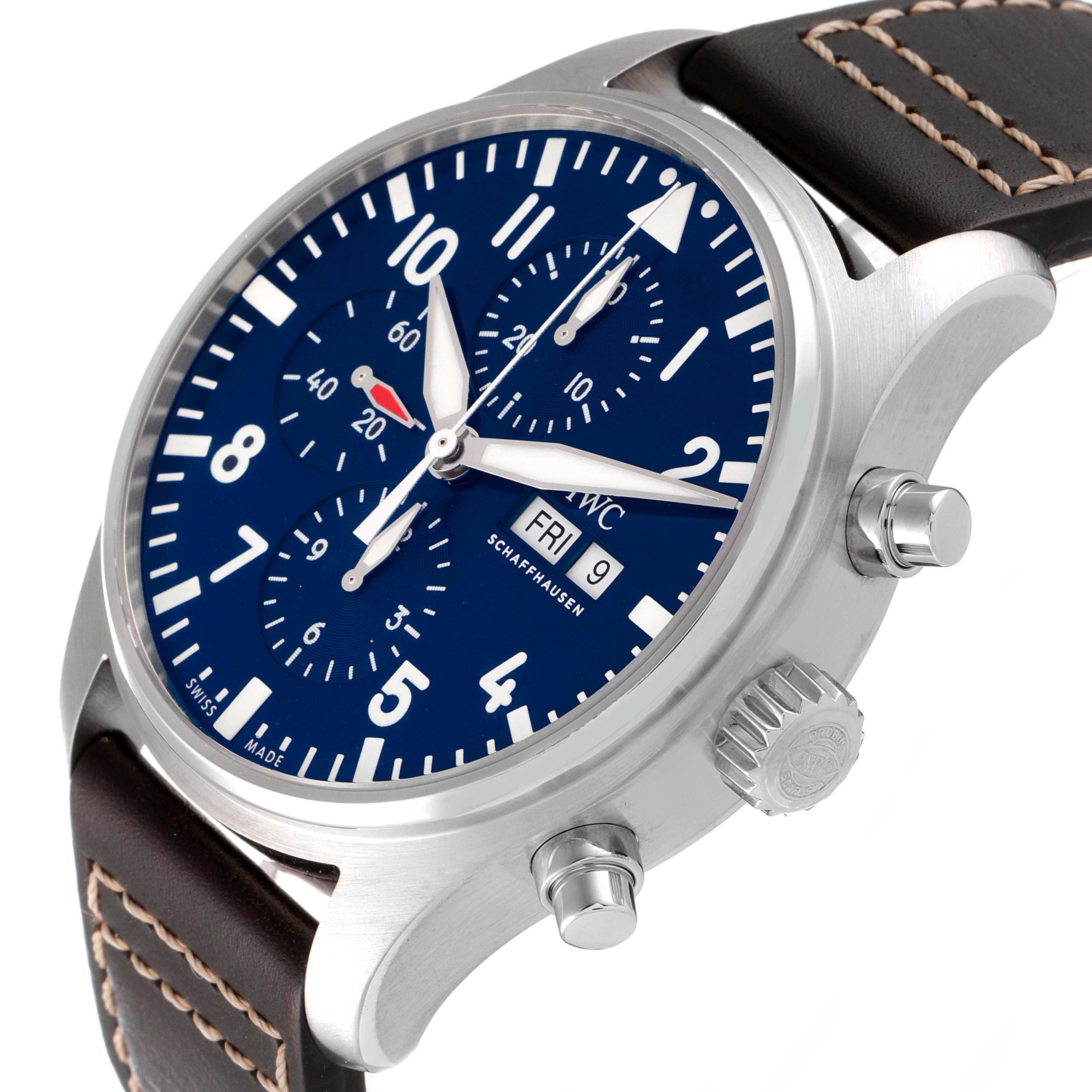 The image shows an angled view of the IWC Pilot IW377714 Men's Stainless Steel Blue Dial IW377714 Men's Stainless Steel Blue Dial model, highlighting its blue dial, crown, pushers, and leather strap with stitching.