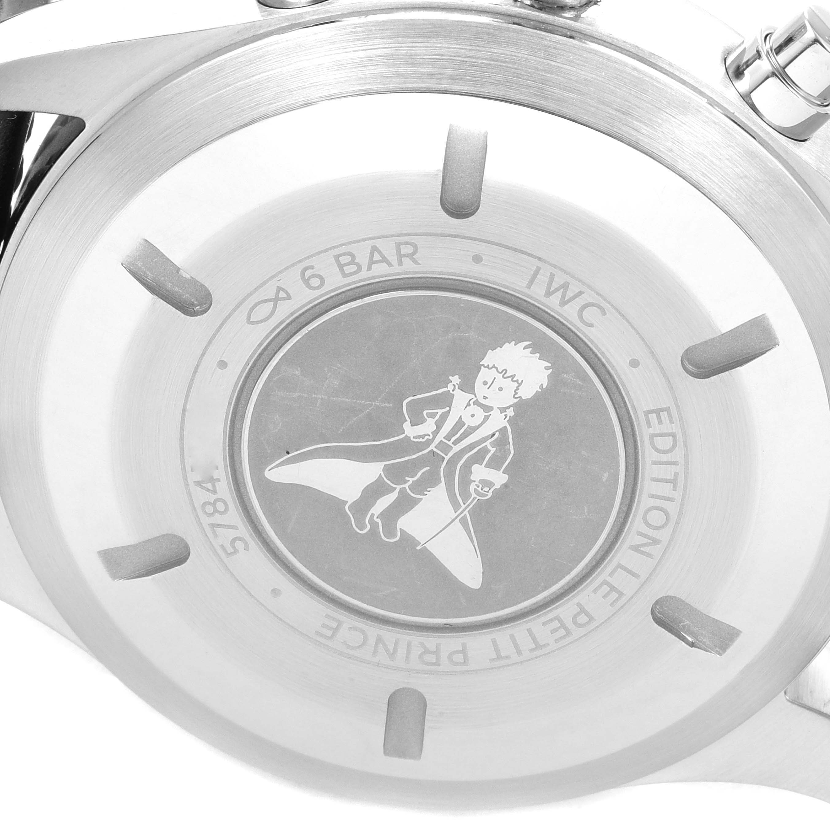 The image shows the back case of the IWC Pilot IW377714 Men's Stainless Steel Blue Dial IW377714 Men's Stainless Steel Blue Dial watch, depicting "Le Petit Prince" engraving.