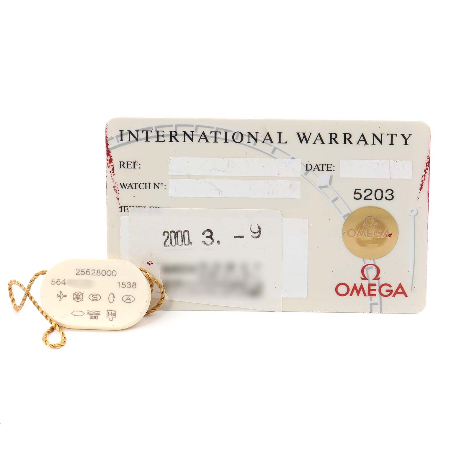 The image shows an Omega Seamaster 2562.80.00 Men
s Stainless Steel Blue Dial 2562.80.00 Men
s Stainless Steel Blue Dial model international warranty card and a tag with model and serial numbers.