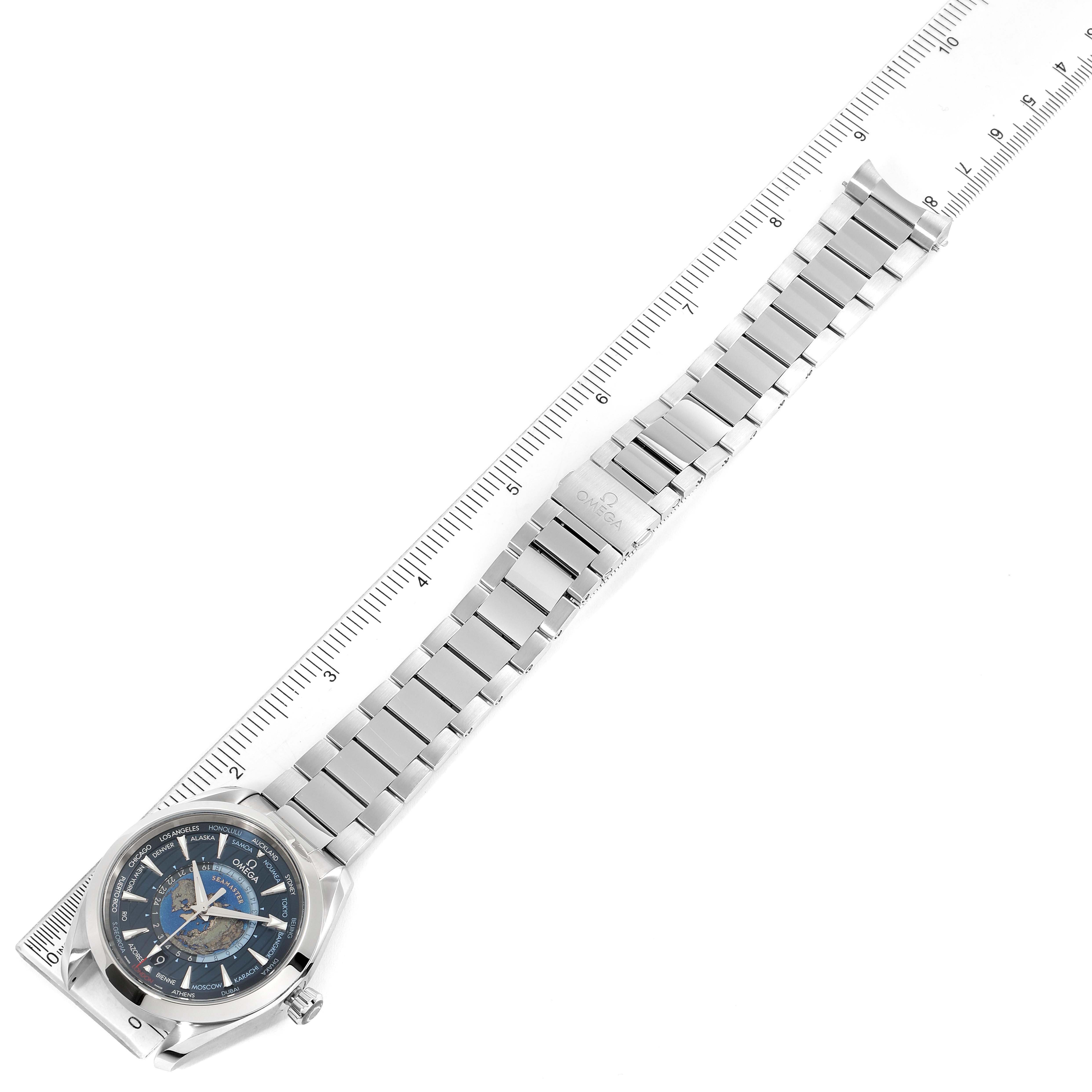 The Omega Aqua Terra 220.10.43.22.03.001 Men's Stainless Steel Blue Dial 220.10.43.22.03.001 Men's Stainless Steel Blue Dial watch is displayed flat, showing its face, metal bracelet, and deployment clasp alongside a ruler for scale.