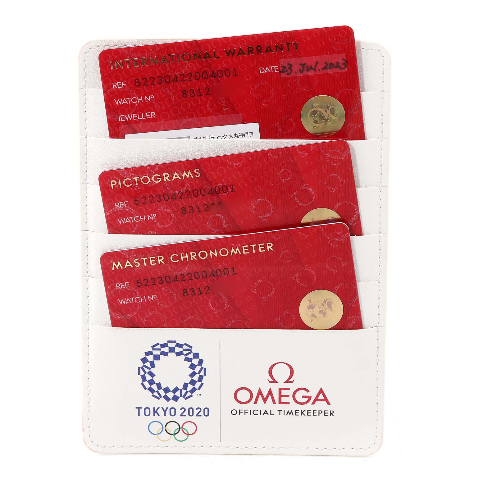 The image shows warranty cards and documentation for the Omega Seamaster 522.30.42.20.04.001 Men's Stainless Steel White Dial 522.30.42.20.04.001 Men's Stainless Steel White Dial watch model, including international warranty, pictograms, and master chronometer cards.