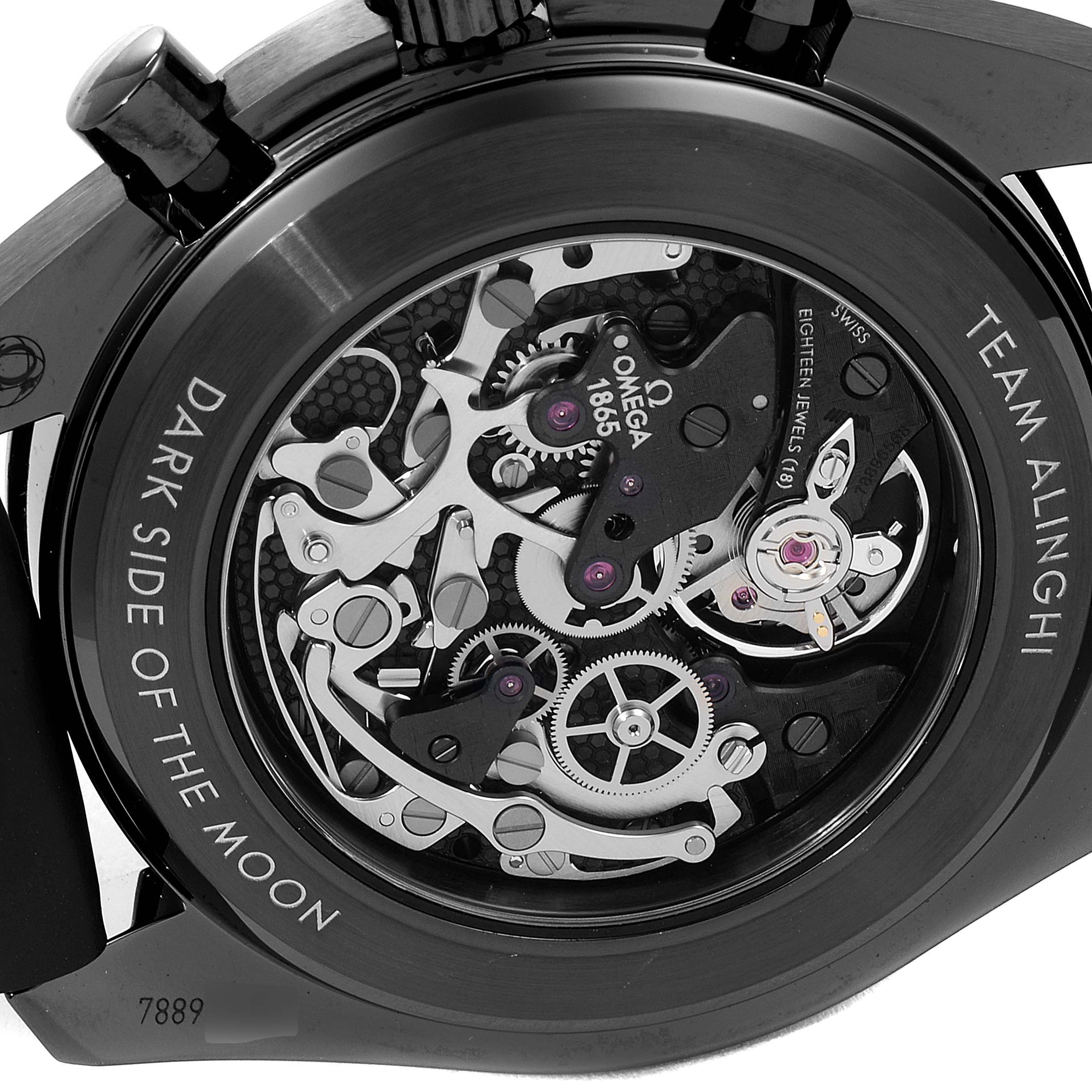 The image shows a close-up of the Omega Speedmaster 311.92.44.30.01.002 Men's Ceramic Black Dial 311.92.44.30.01.002 Men's Ceramic Black Dial's open caseback, focusing on its intricate movement and engravings.