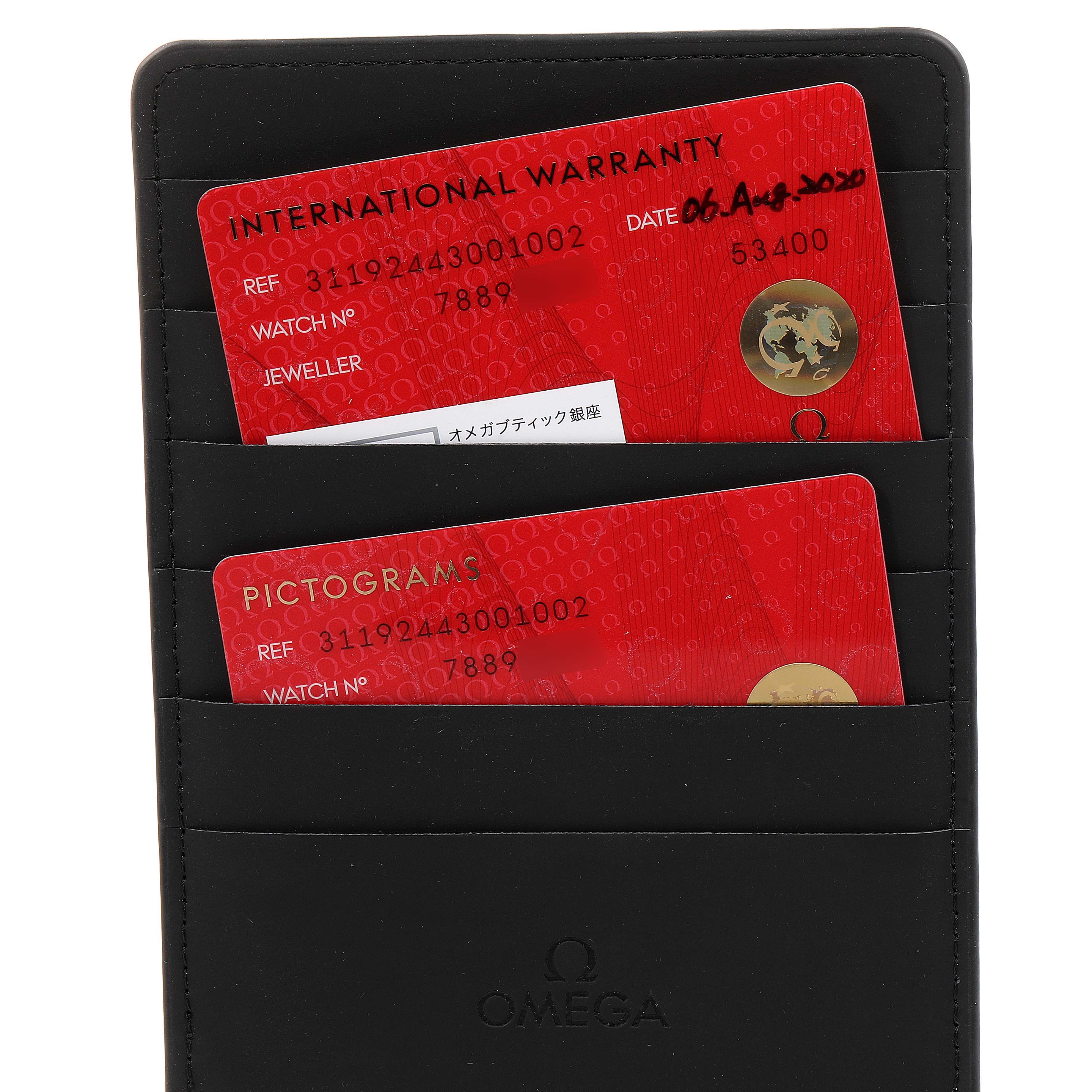 This image shows the warranty and pictogram cards for the Omega Speedmaster 311.92.44.30.01.002 Men's Ceramic Black Dial 311.92.44.30.01.002 Men's Ceramic Black Dial watch in a black cardholder.