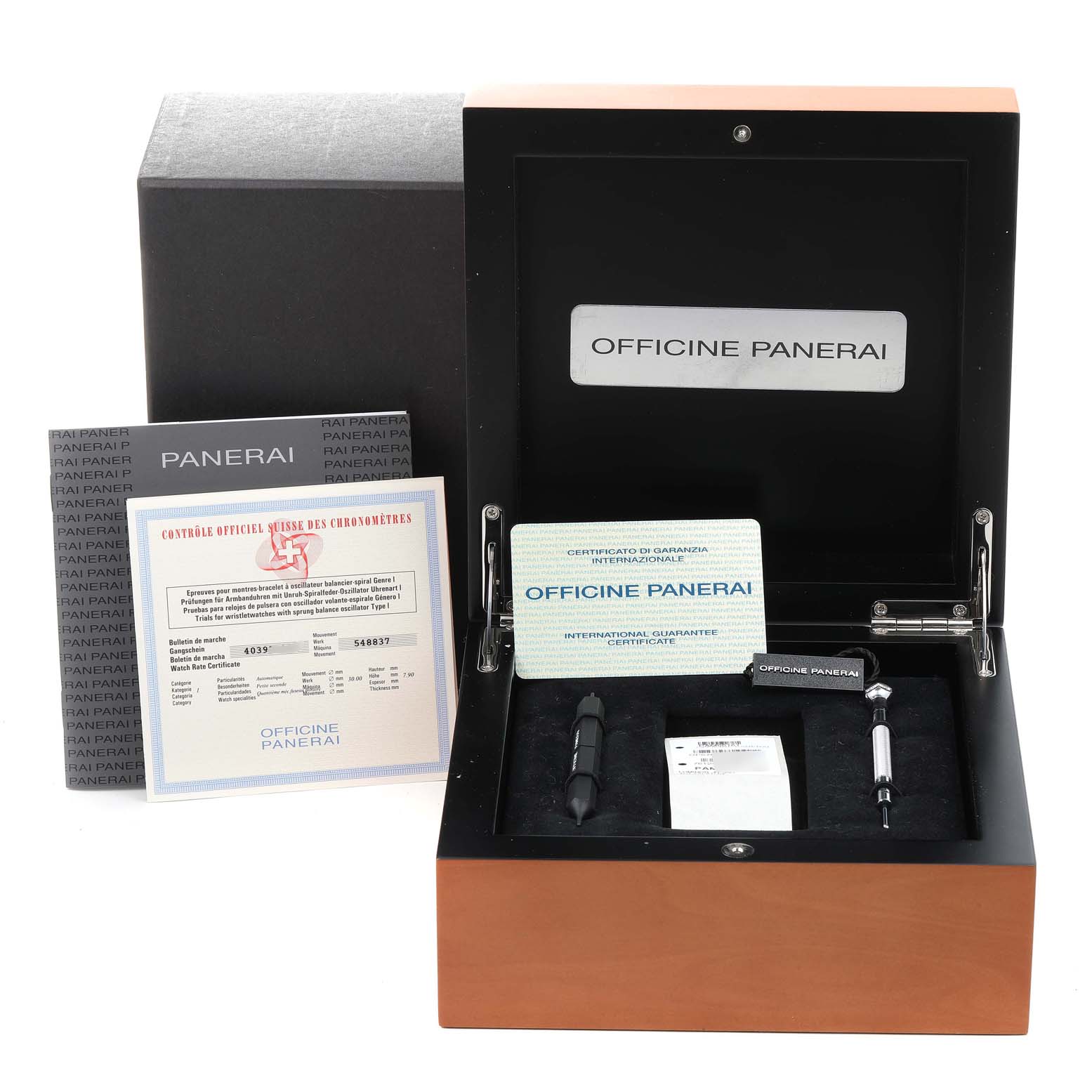 The image shows the packaging, warranty cards, and tools for the Panerai Luminor PAM00161 Men
s Stainless Steel Black Dial PAM00161 Men
s Stainless Steel Black Dial model watch, viewed from above.