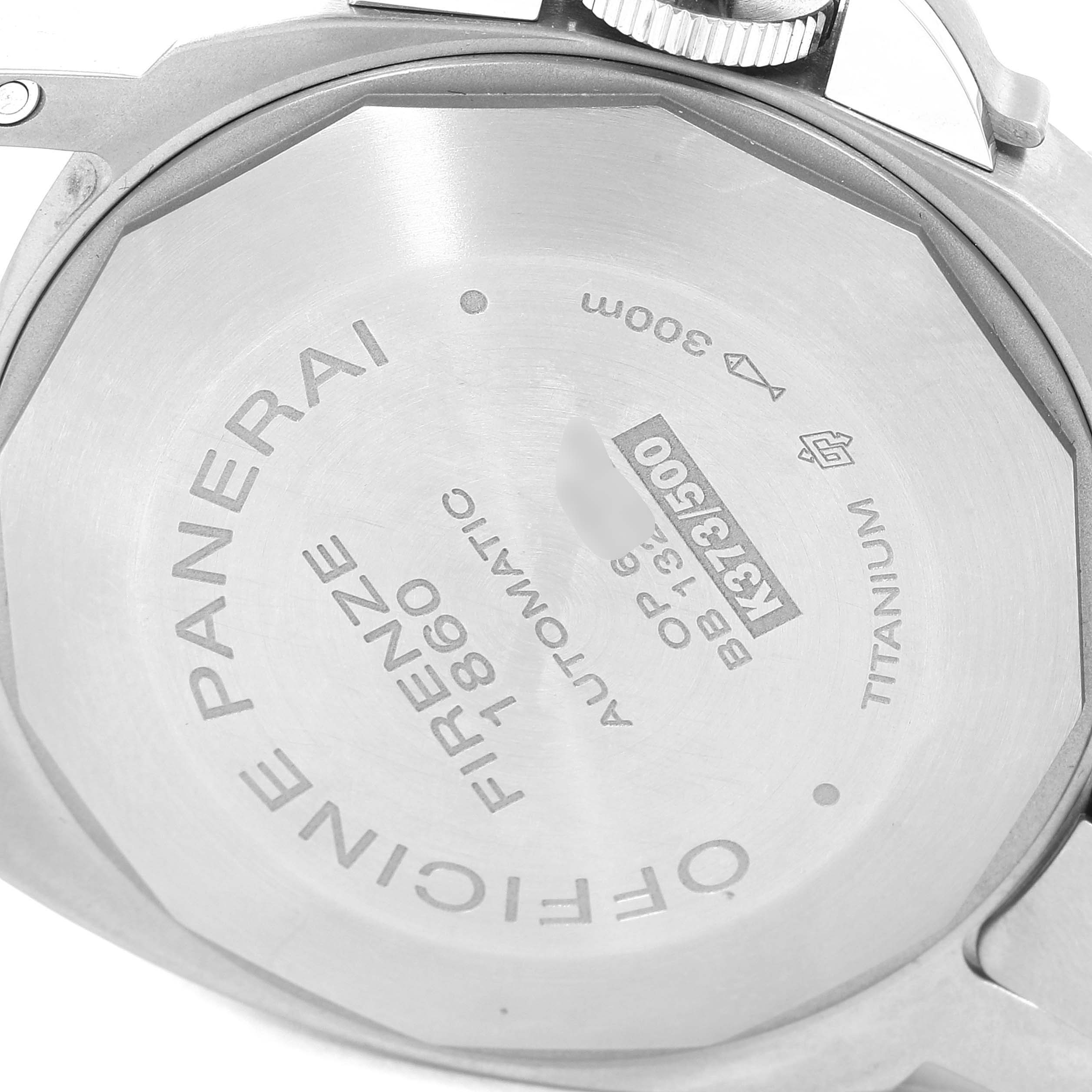 The image shows the rear caseback of a Panerai Luminor PAM00161 Men
s Stainless Steel Black Dial PAM00161 Men
s Stainless Steel Black Dial watch, highlighting its inscriptions and titanium material.