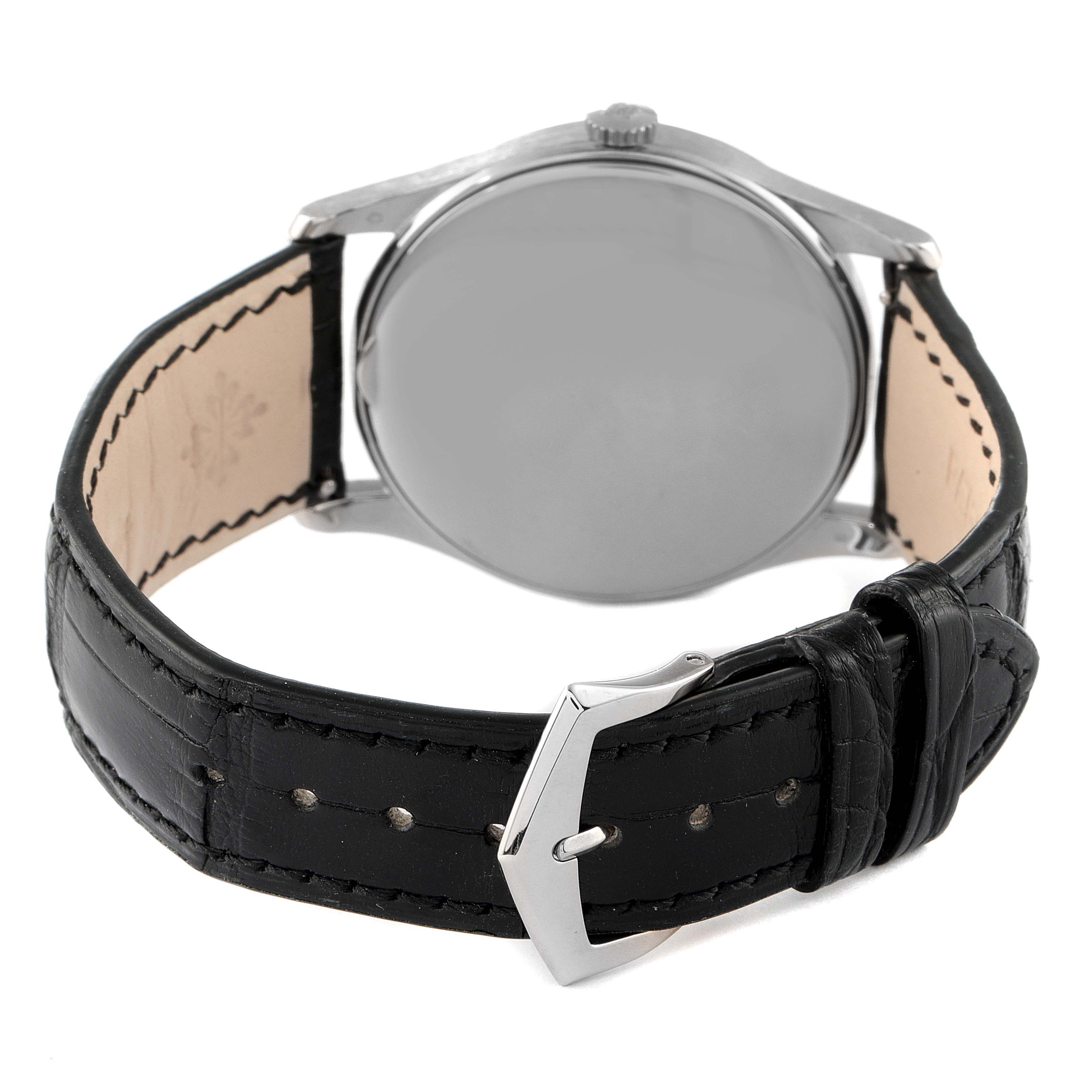 This image shows the back of a Patek Philippe Calatrava 5196G Men's White Gold Silver Dial 5196G Men's White Gold Silver Dial watch and its black leather strap with a buckle.