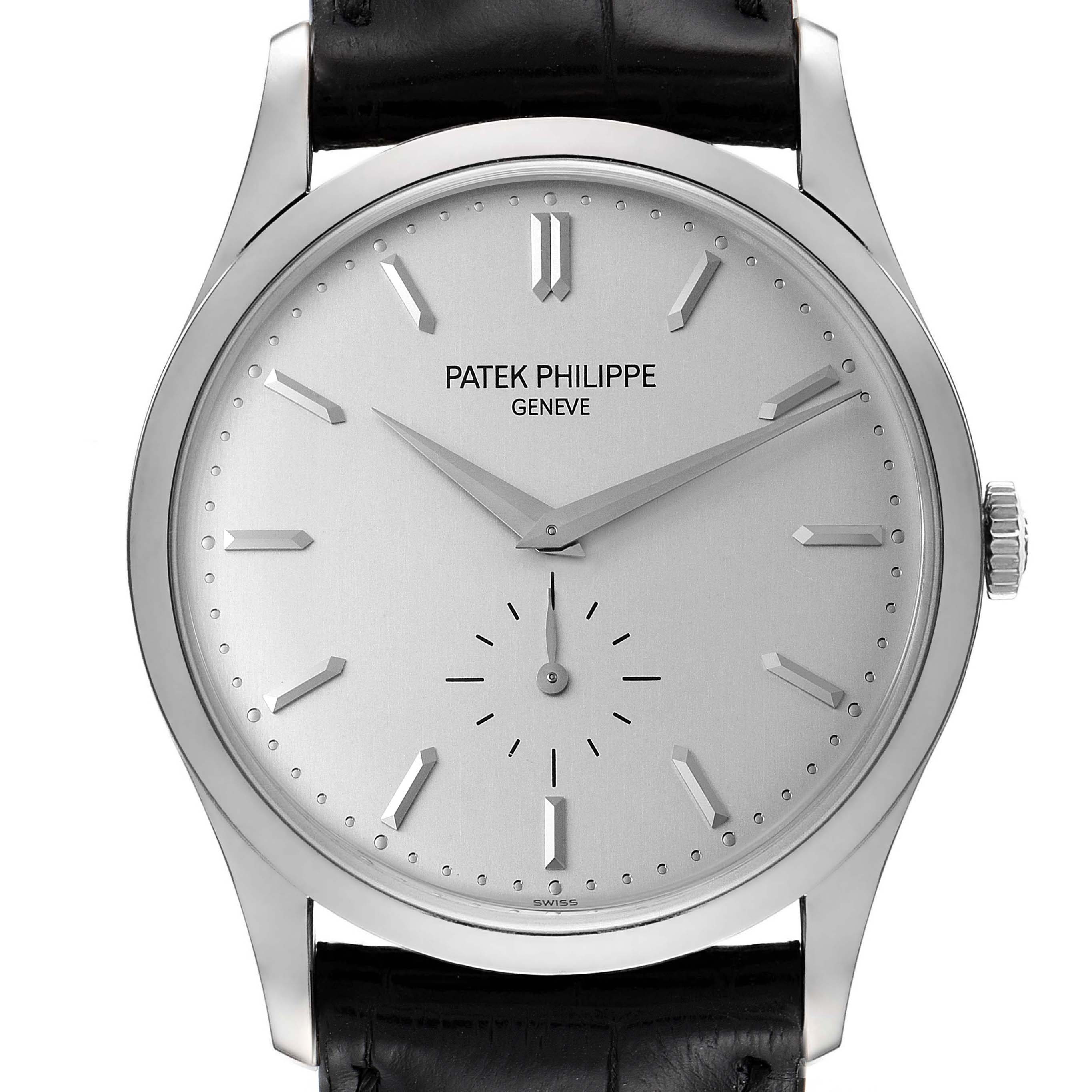 The image shows a front view of a Patek Philippe Calatrava 5196G Men's White Gold Silver Dial 5196G Men's White Gold Silver Dial watch, highlighting its face, hands, and a portion of its leather strap.