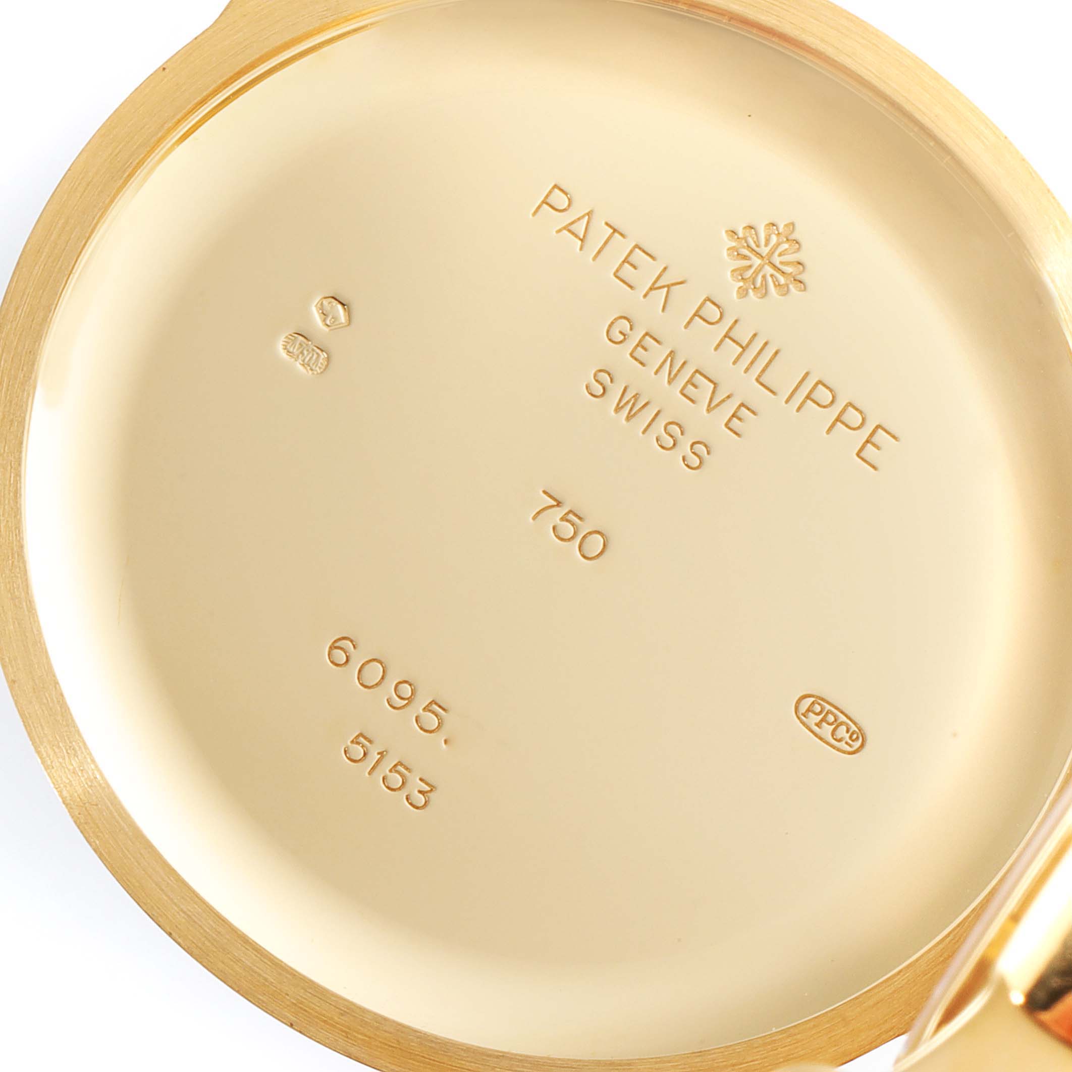 The image shows the inner back case of a Patek Philippe Calatrava 5153J Men's Yellow Gold Silver Dial 5153J Men's Yellow Gold Silver Dial watch, displaying various inscriptions and hallmarks.