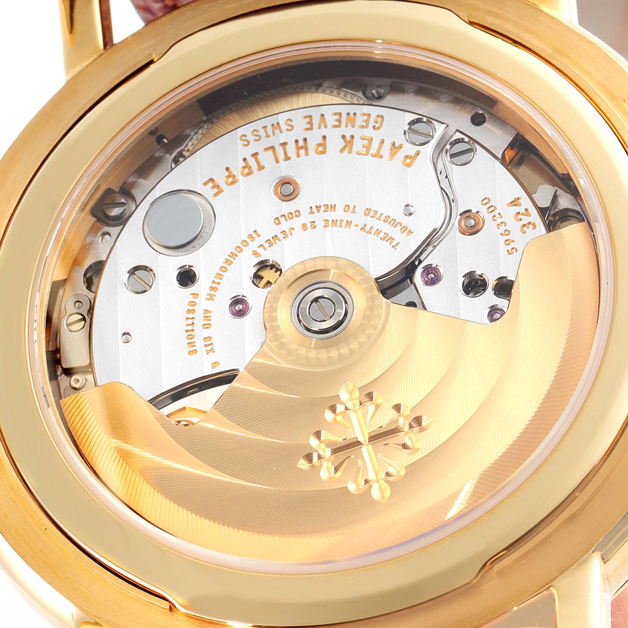 This image shows the back view of the Patek Philippe Calatrava 5153J Men's Yellow Gold Silver Dial 5153J Men's Yellow Gold Silver Dial model, highlighting its intricate movement and rotor.