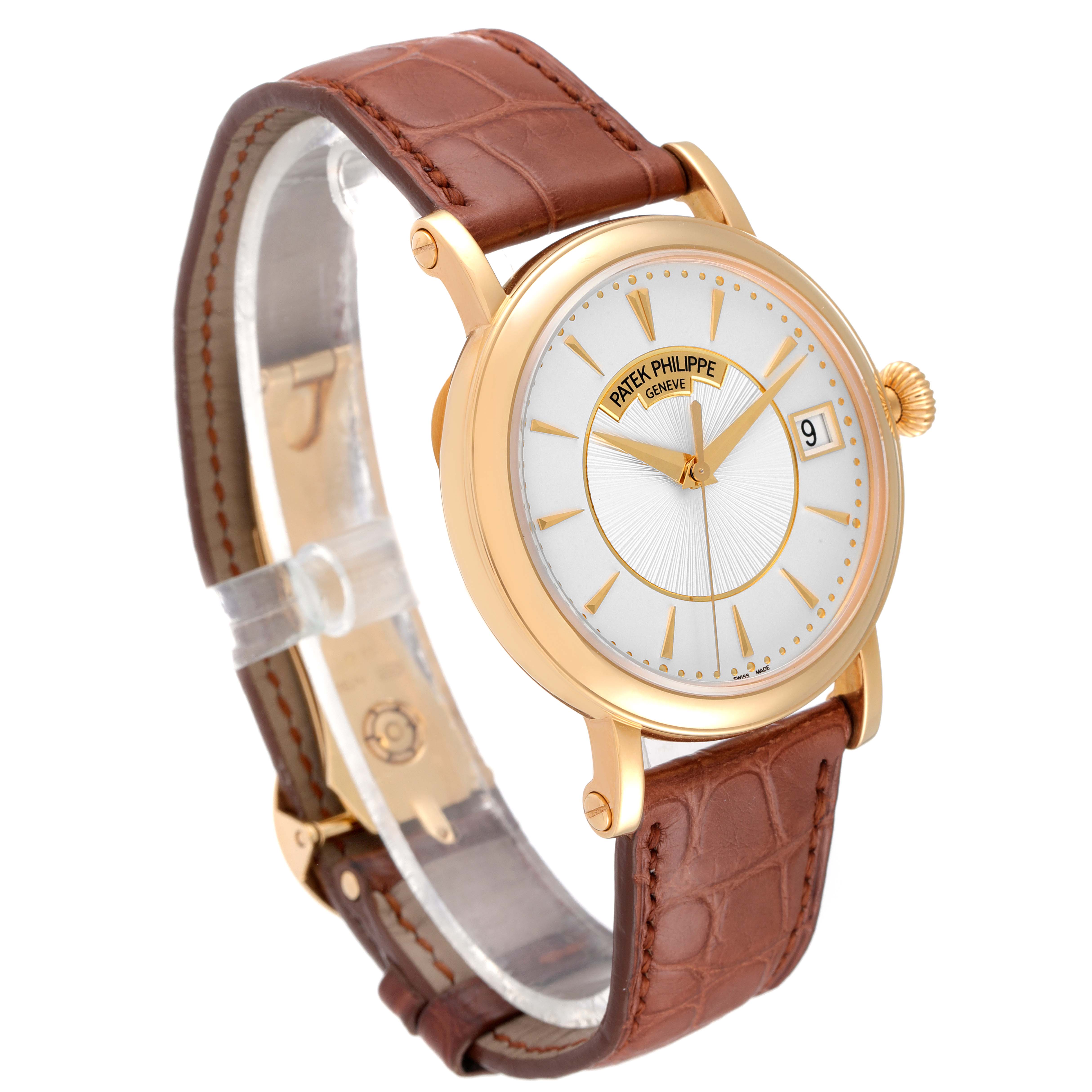 This image shows a side angle of the Patek Philippe Calatrava 5153J Men's Yellow Gold Silver Dial 5153J Men's Yellow Gold Silver Dial with a brown leather strap and gold case.