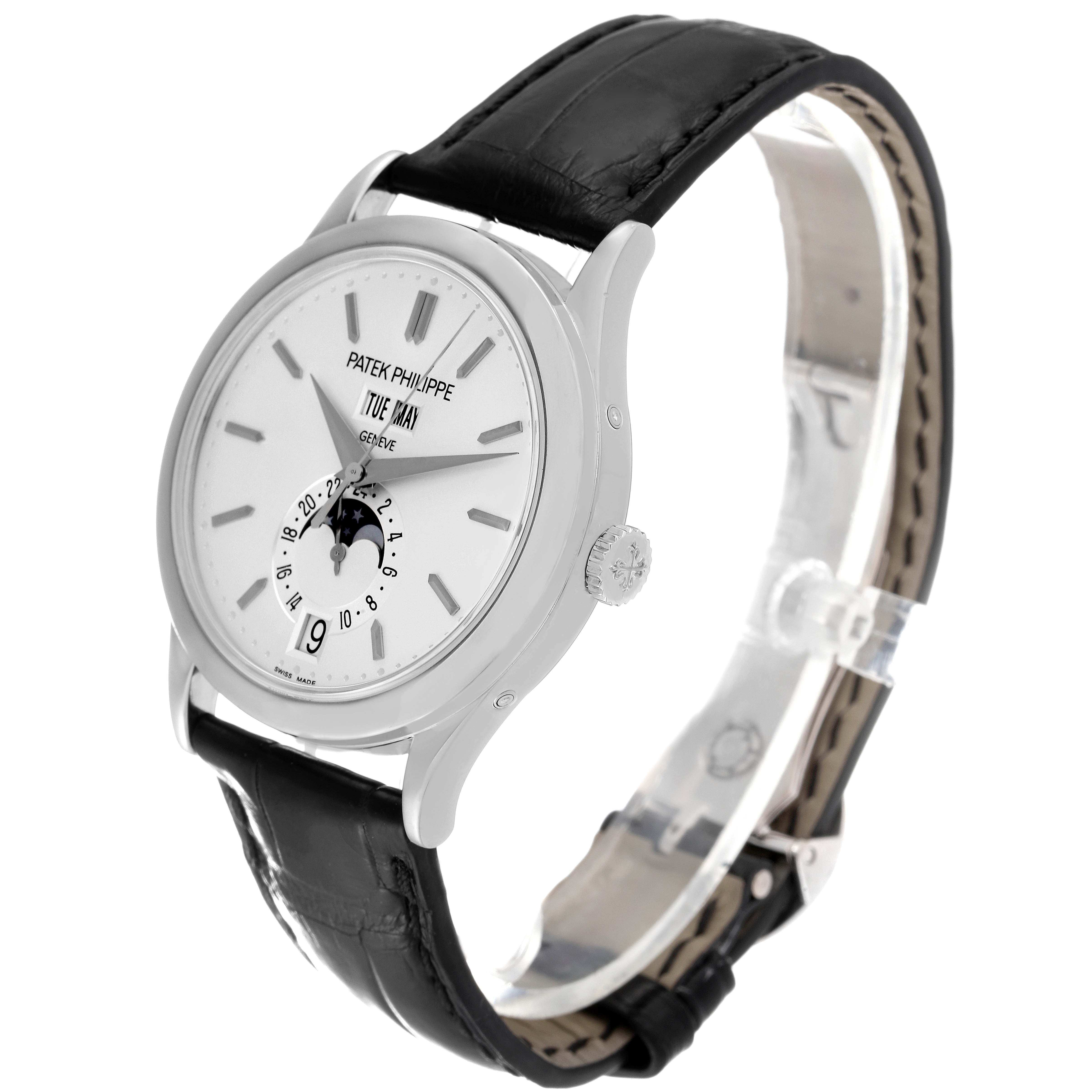 This image shows a Patek Philippe Complications 5396G-011 Men's White Gold Silver Dial 5396G-011 Men's White Gold Silver Dial watch at an angle displaying the face, crown, and leather strap.