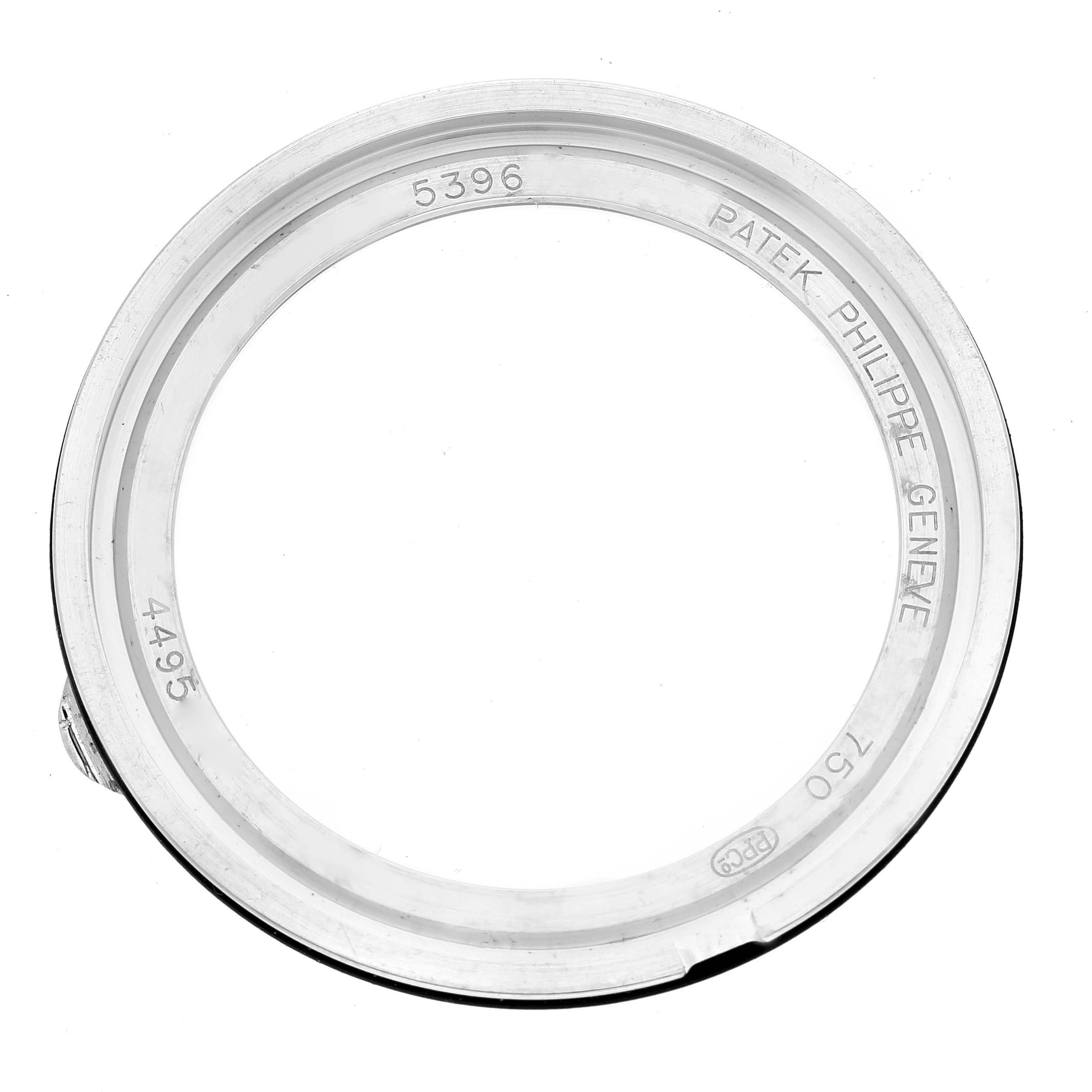 This image shows the bezel and part of the case from the Patek Philippe Complications 5396G-011 Men's White Gold Silver Dial 5396G-011 Men's White Gold Silver Dial model, viewed from the top.