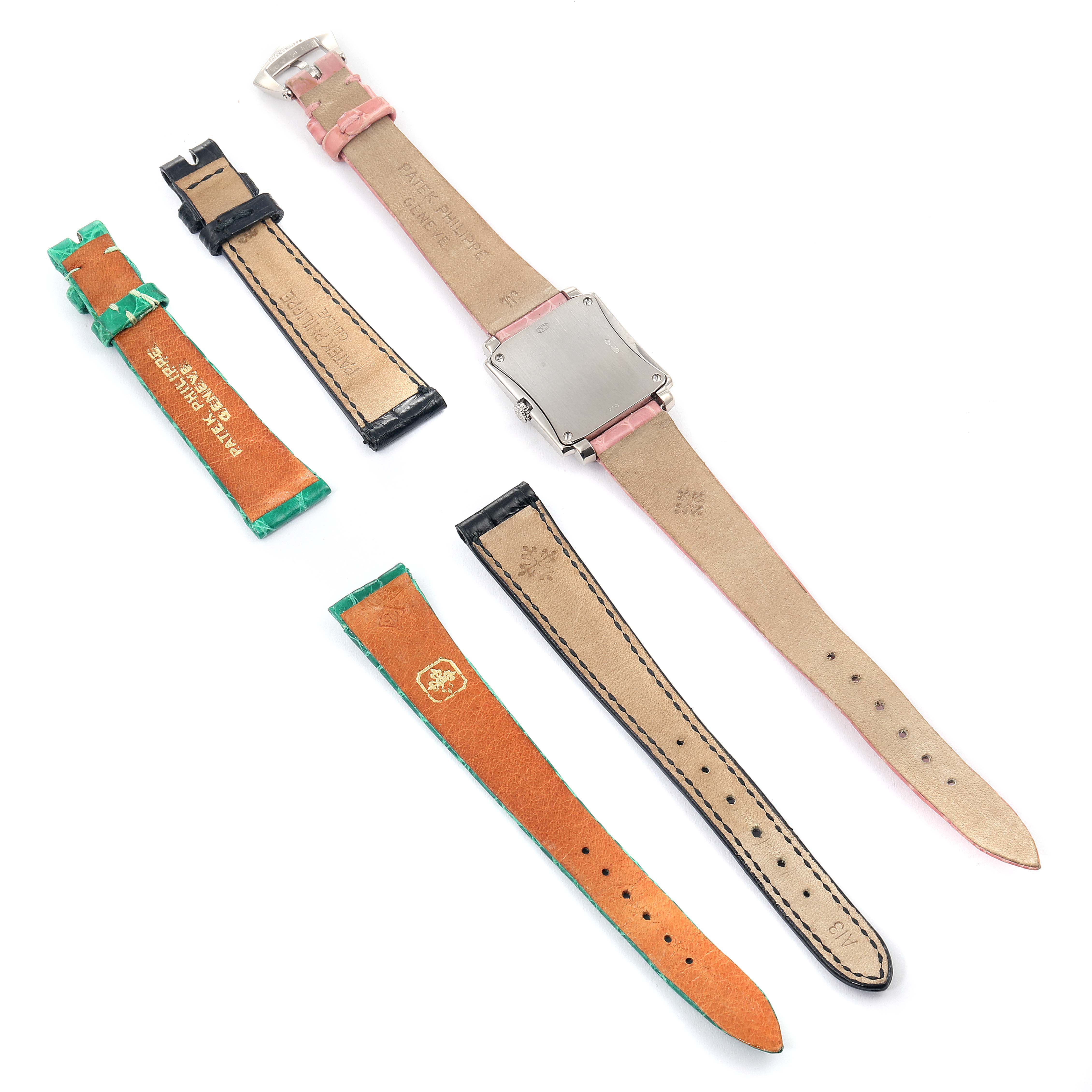 This image shows the back of a Patek Philippe Gondolo 4824 Women's White Gold White Dial 4824 Women's White Gold White Dial watch with additional leather straps displayed separately.