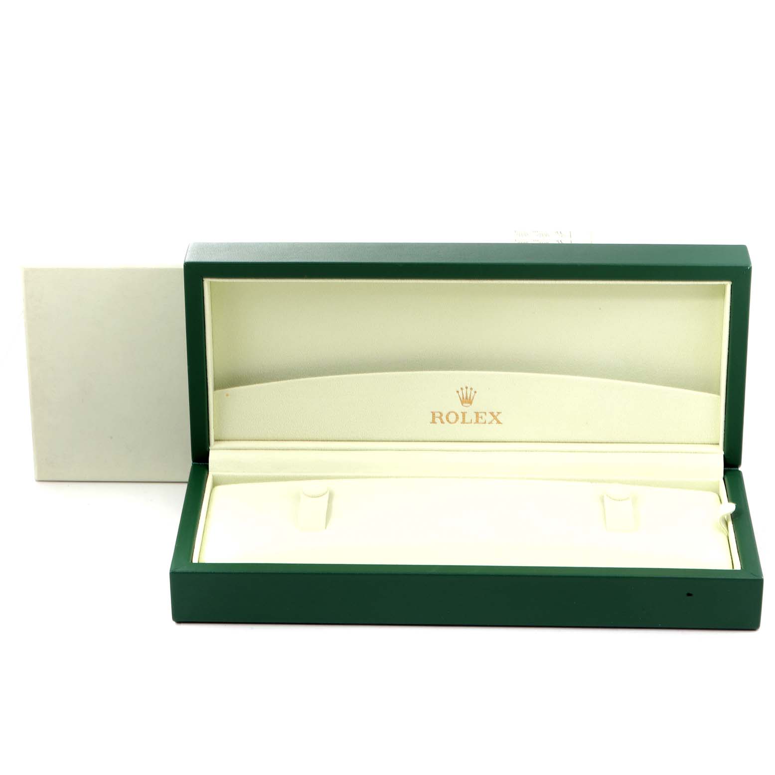 This image shows an open Rolex Cellini 50515 Men's Rose Gold Silver Dial 50515 Men's Rose Gold Silver Dial watch box with its green exterior and cream interior, displaying the Rolex logo.