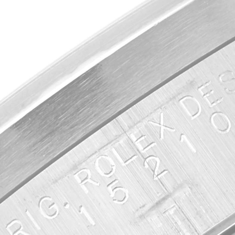 This close-up image shows the engraved serial number on the case of a Rolex Date 15210 Men's Stainless Steel Black Dial 15210 Men's Stainless Steel Black Dial model watch.