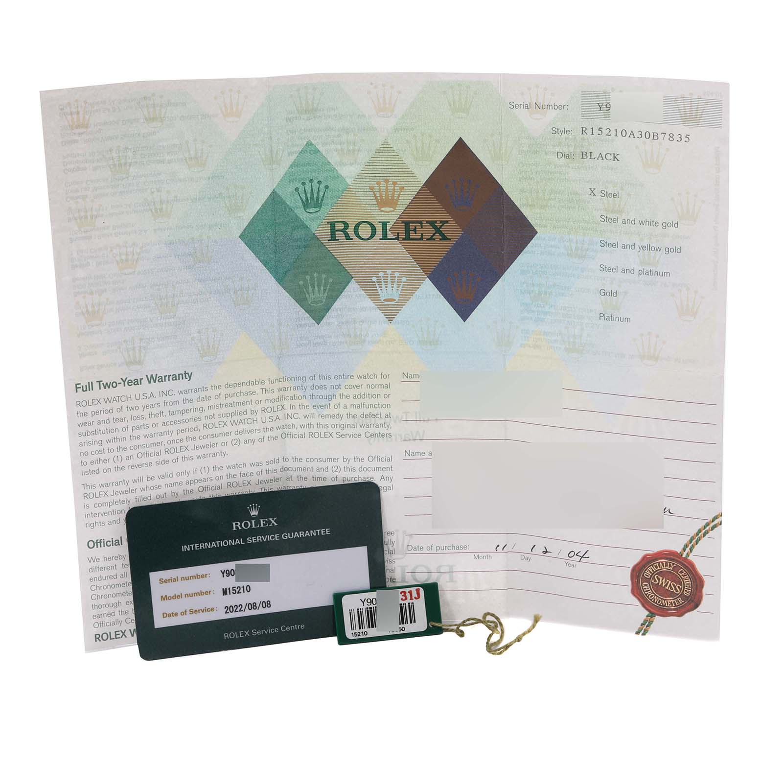 The image shows the warranty card and tags for a Rolex Date 15210 Men's Stainless Steel Black Dial 15210 Men's Stainless Steel Black Dial model watch including serial and model numbers.