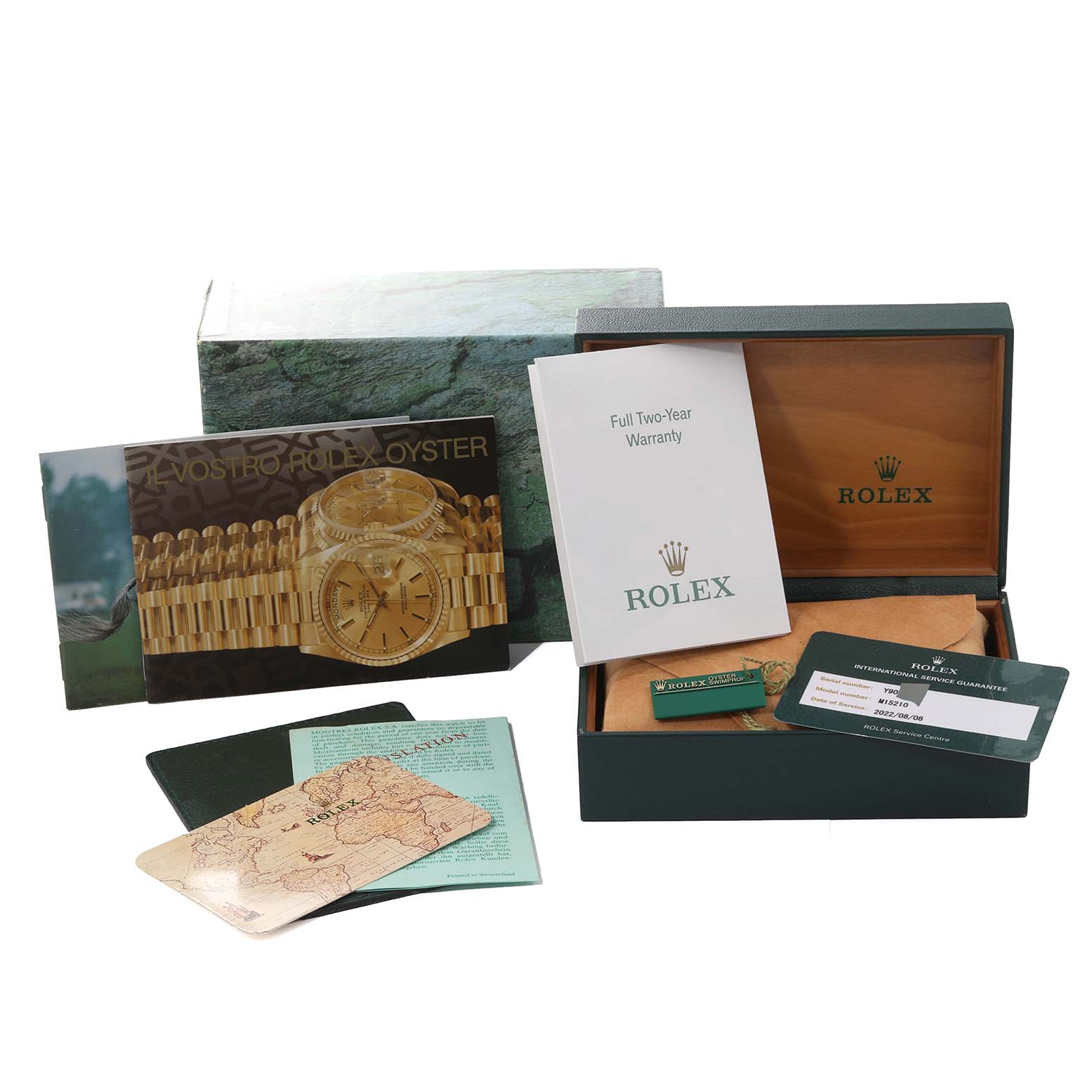 The image shows a Rolex Date 15210 Men's Stainless Steel Black Dial 15210 Men's Stainless Steel Black Dial model watch box and accessories, including manuals, warranty card, and tags.