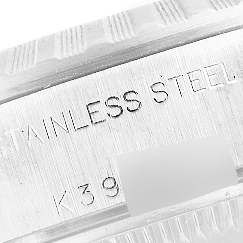 The image shows a close-up, angled view of the engraved bezel and casing of a Rolex Datejust 79240 Women's Stainless Steel White Dial 79240 Women's Stainless Steel White Dial watch.