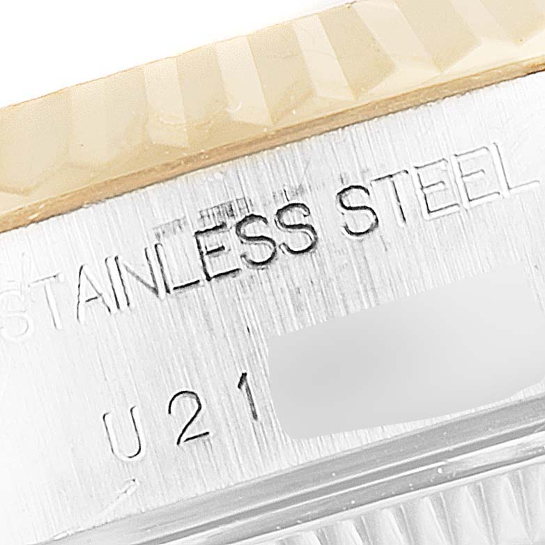 The image shows a close-up view of the side of the Rolex Datejust 69173 Women's Steel and Gold (two tone) Blue Dial 69173 Women's Steel and Gold (two tone) Blue Dial watch, highlighting the "STAINLESS STEEL" engraving.